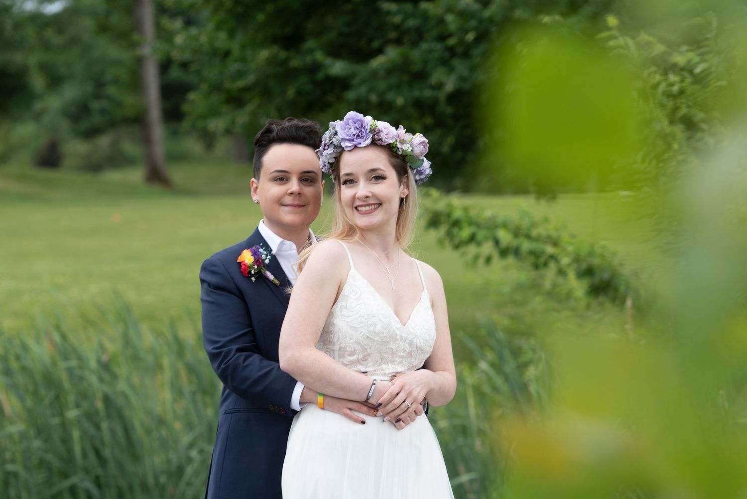 Emotional moment from an LGBTQ+ wedding ceremony captured in natural light.