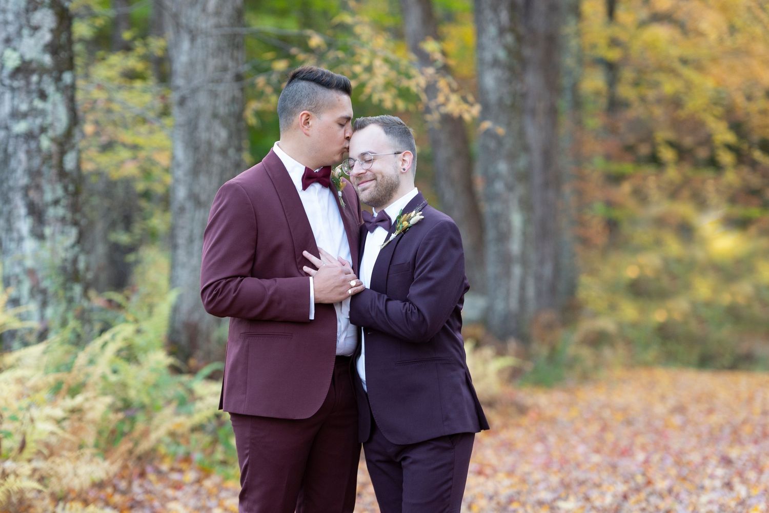Two grooms celebrating their outdoor wedding in Vermont.