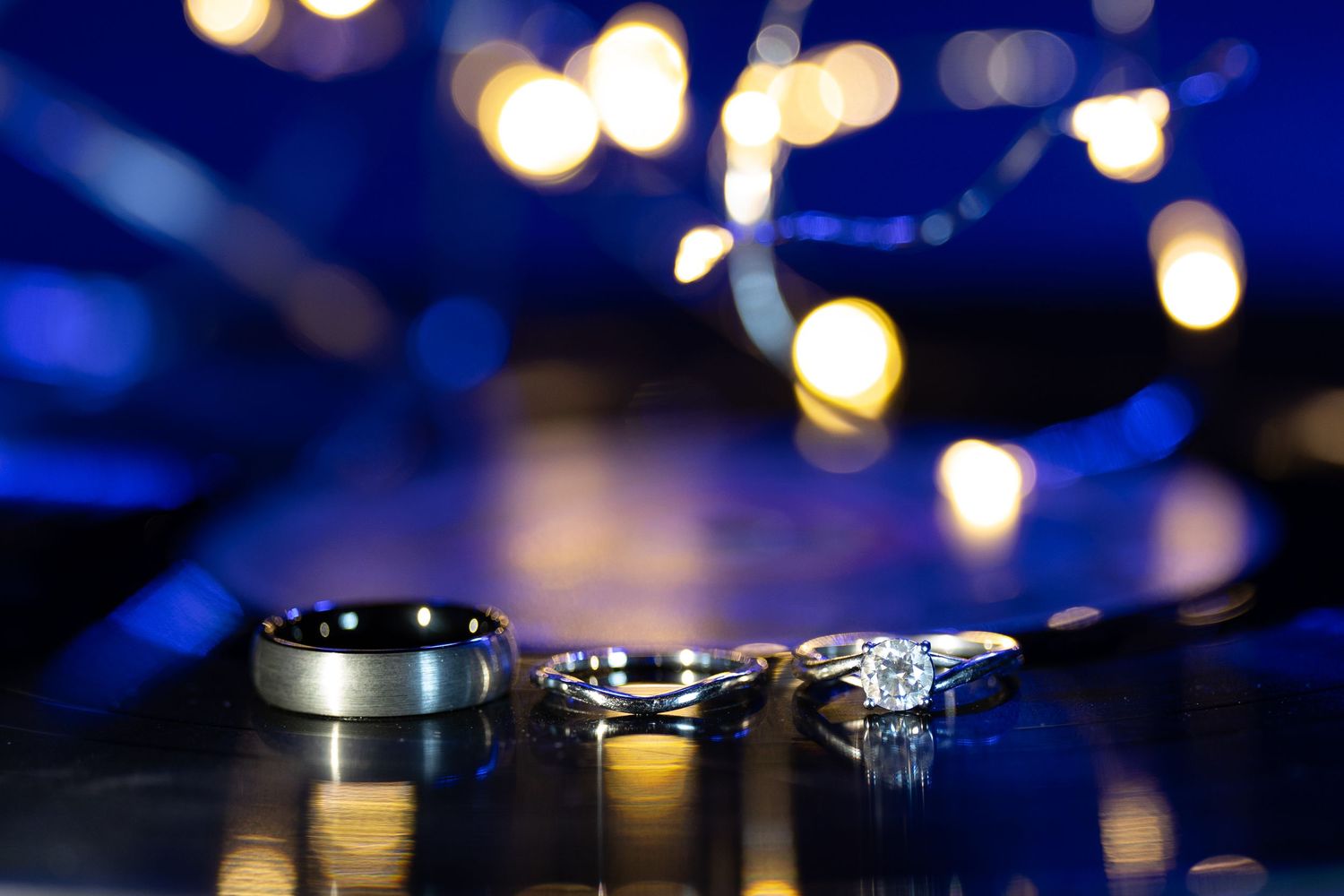 Elegant wedding ring photography highlighting engagement and wedding bands.