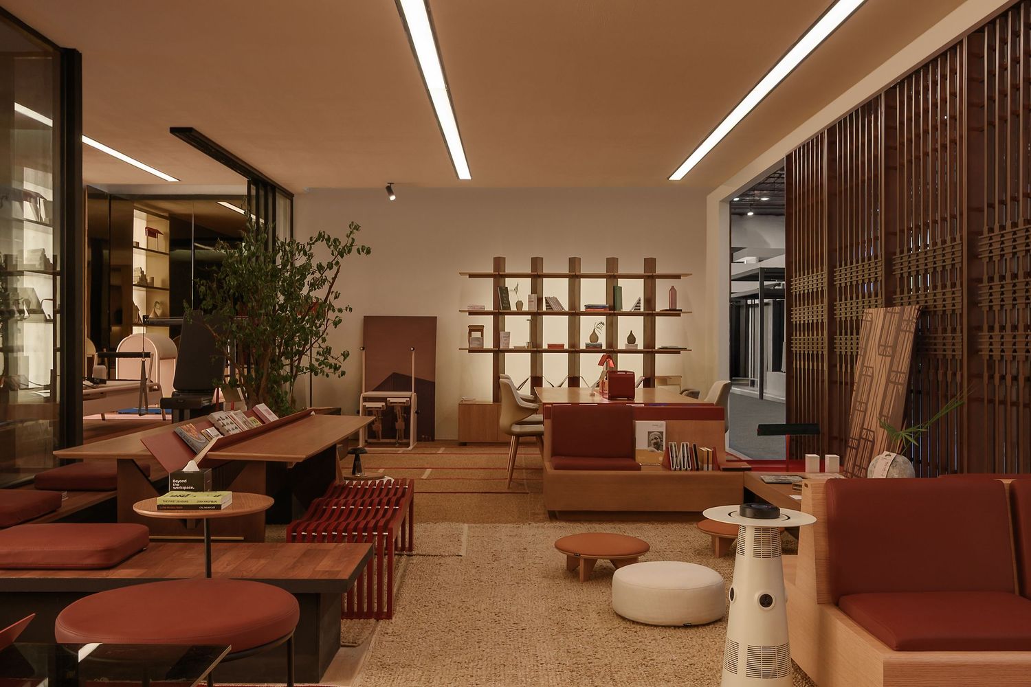 Luxurious lounge area with terracotta-colored seating and modern architectural details. Interior Photography