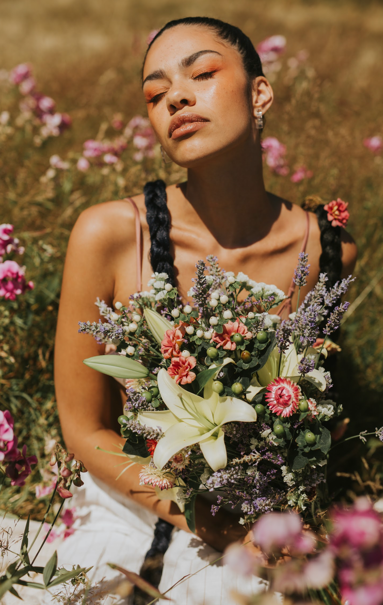 Summer portrait with vibrant wildflowers and lily bouquet in golden field.