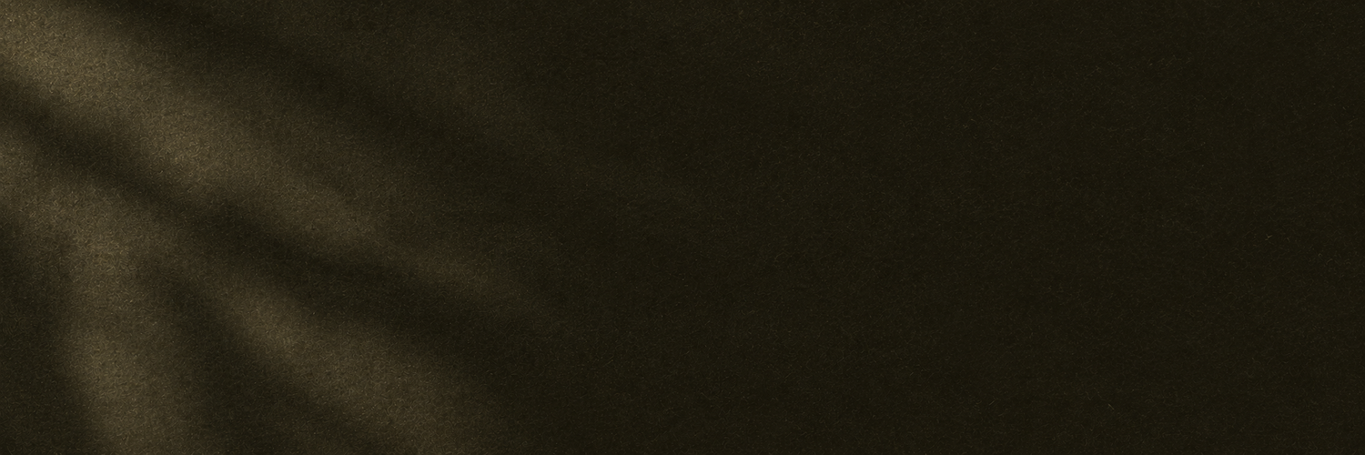Dark olive green textured fabric background with subtle shadow overlay creating a moody, elegant aesthetic.