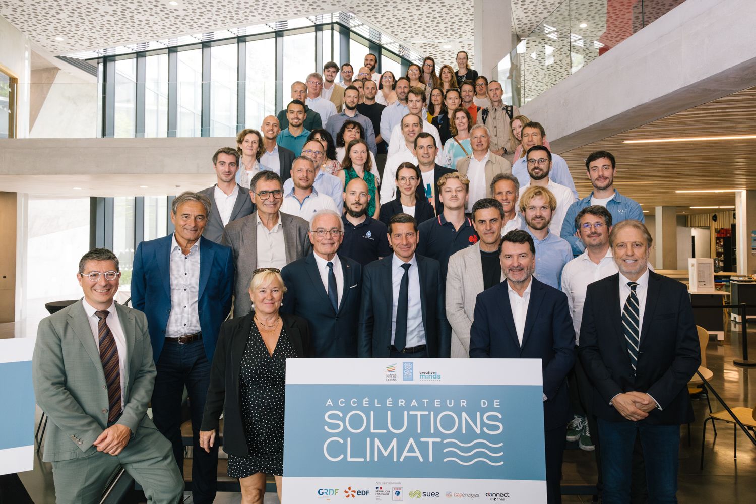 Large group of business professionals gathered for Solutions Climate conference photo.