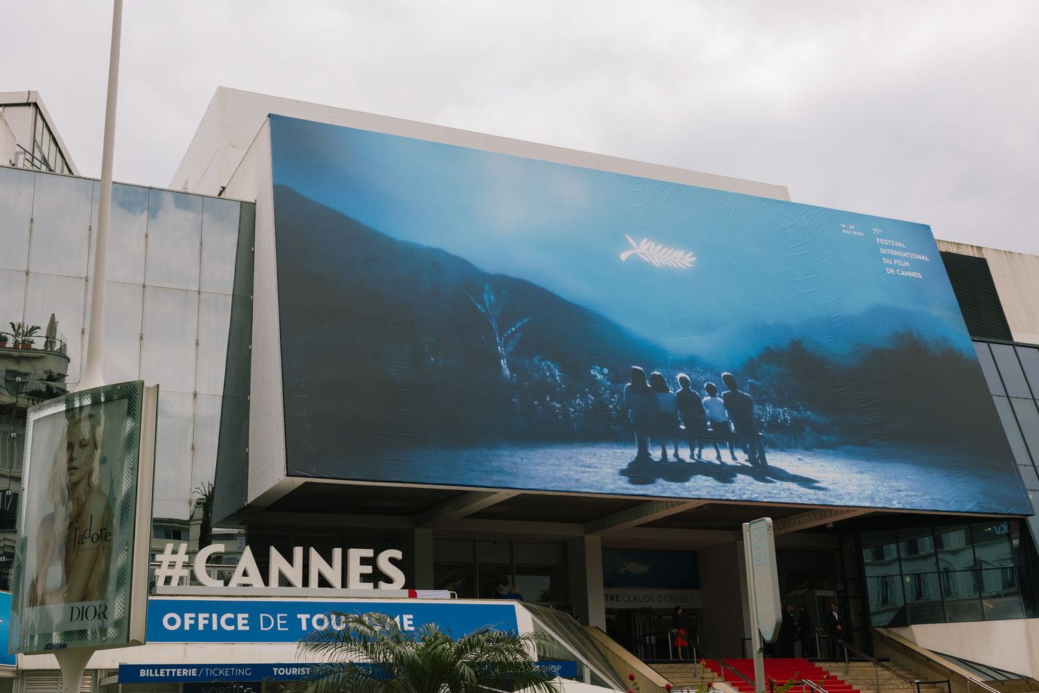 Large promotional display for the Cannes Film Festival outside the tourism office building.