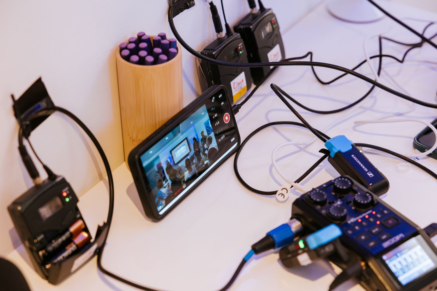 A series of electronic devices and cables connected together showing various gadgets and wiring configurations.