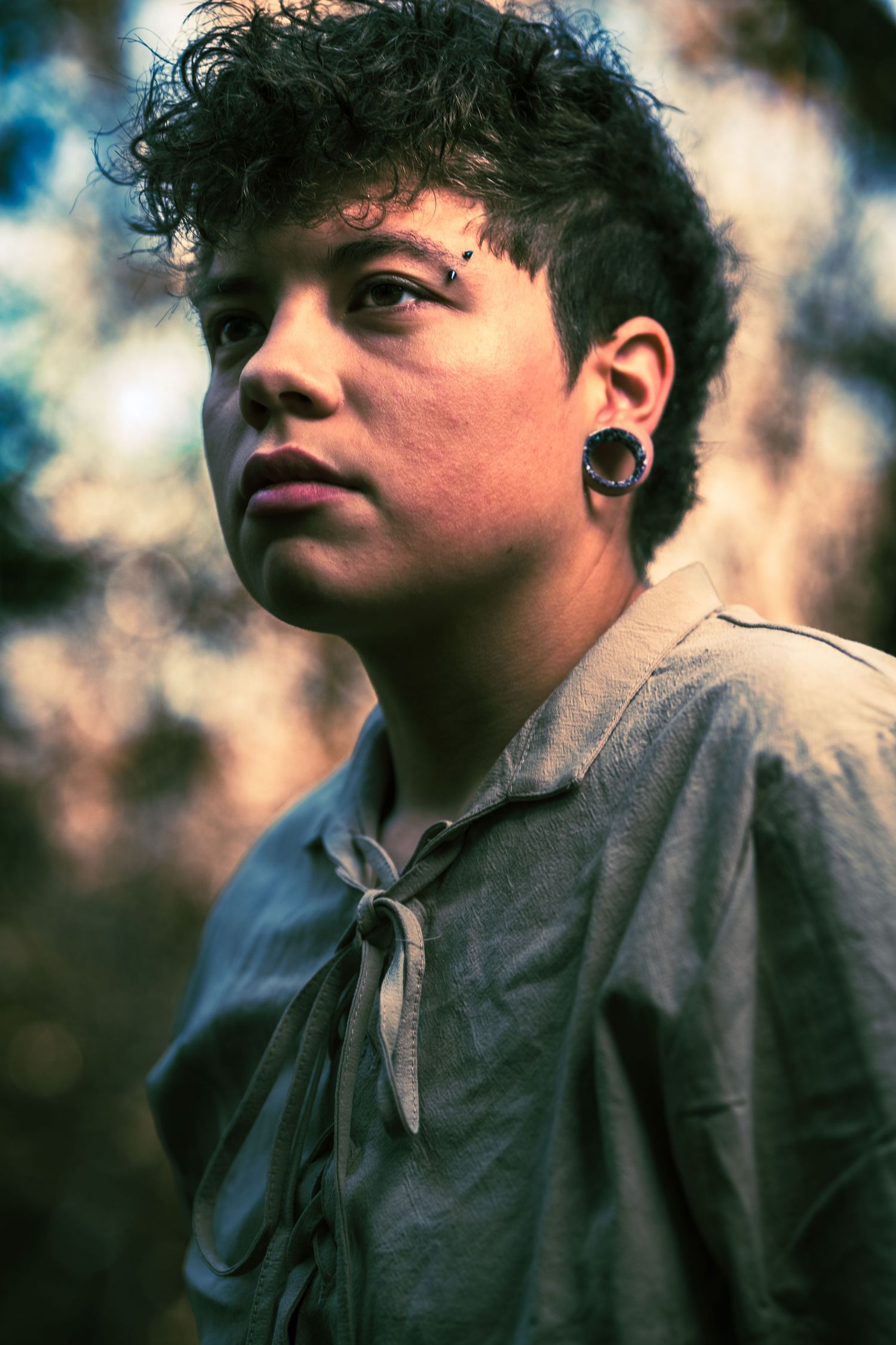 Artistic portrait shot featuring gauzy lighting and vintage-inspired clothing.