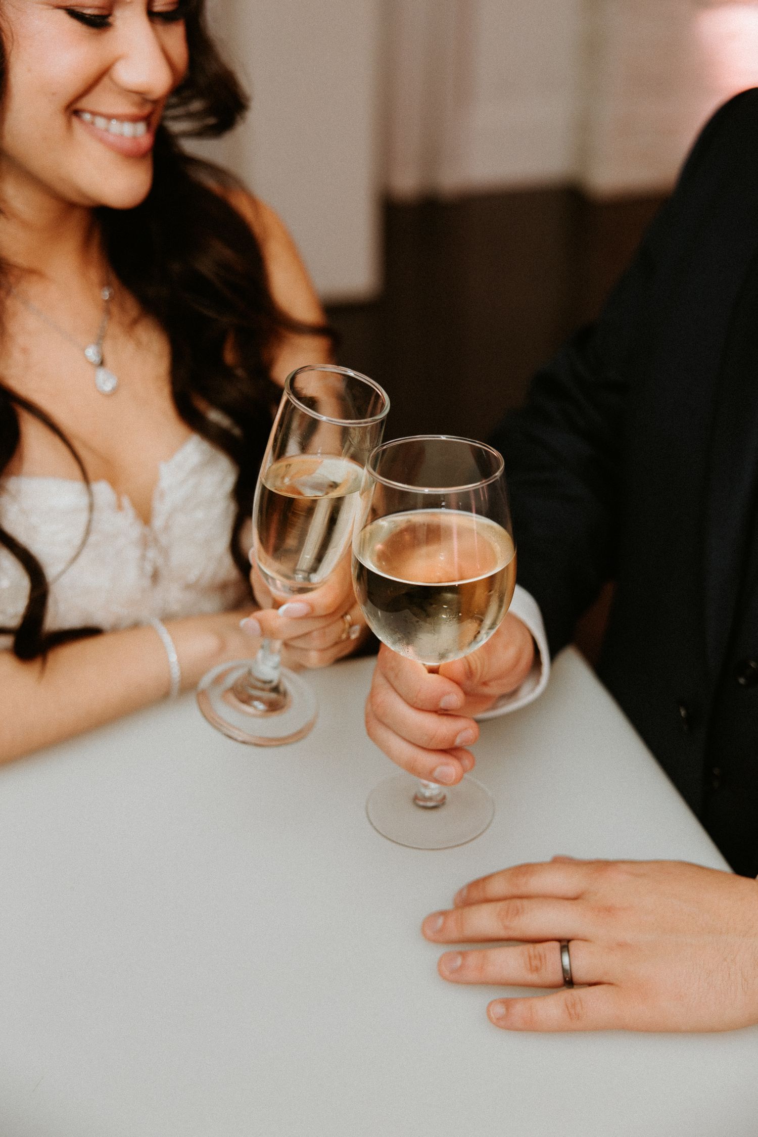 Detailed Shot of Bride and Groom Touched Glasses, Shot by Dylan Spangler