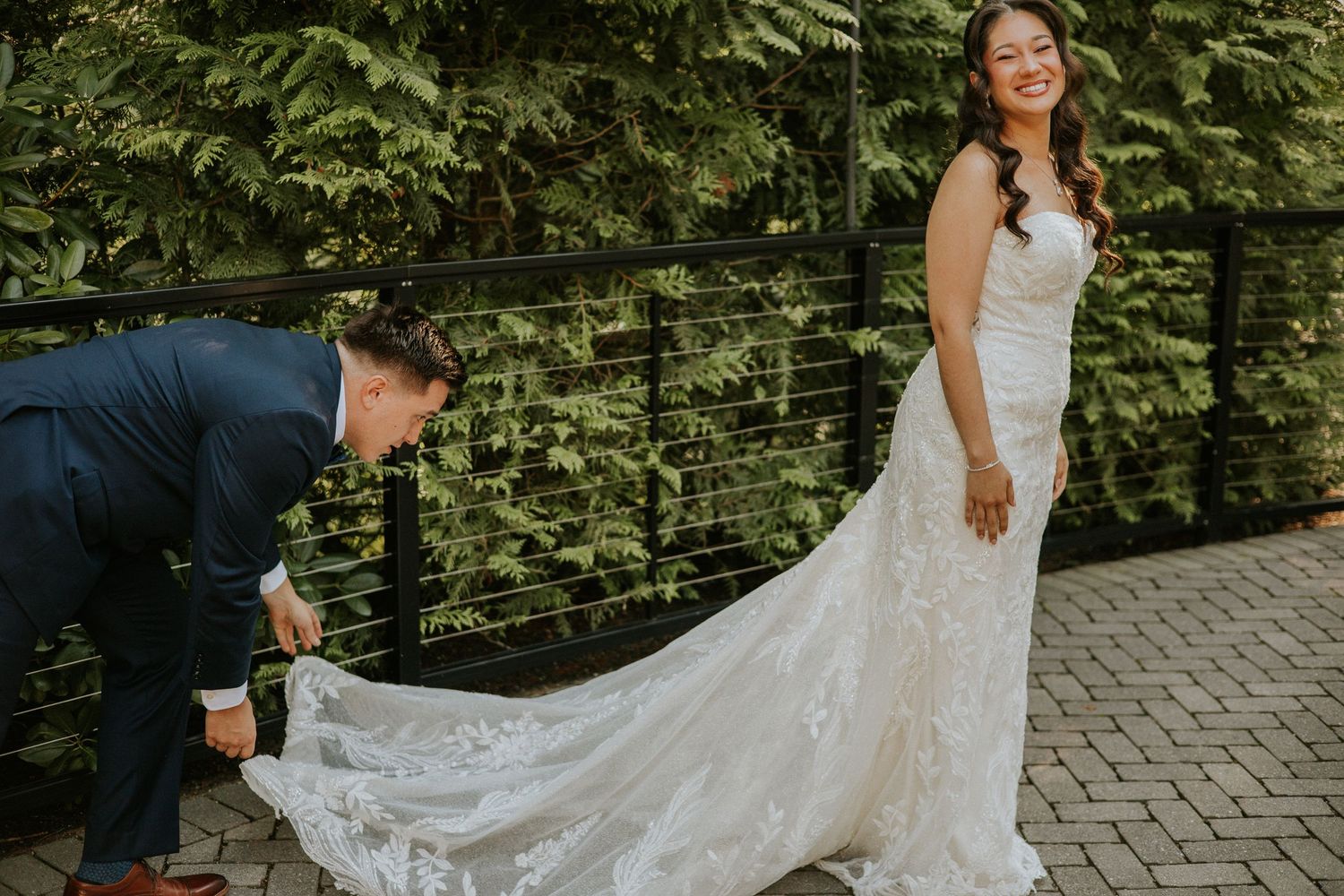 Picture of Groom Carrying Brides Dress on Their Wedding Day, Shot by Dylan Spangler