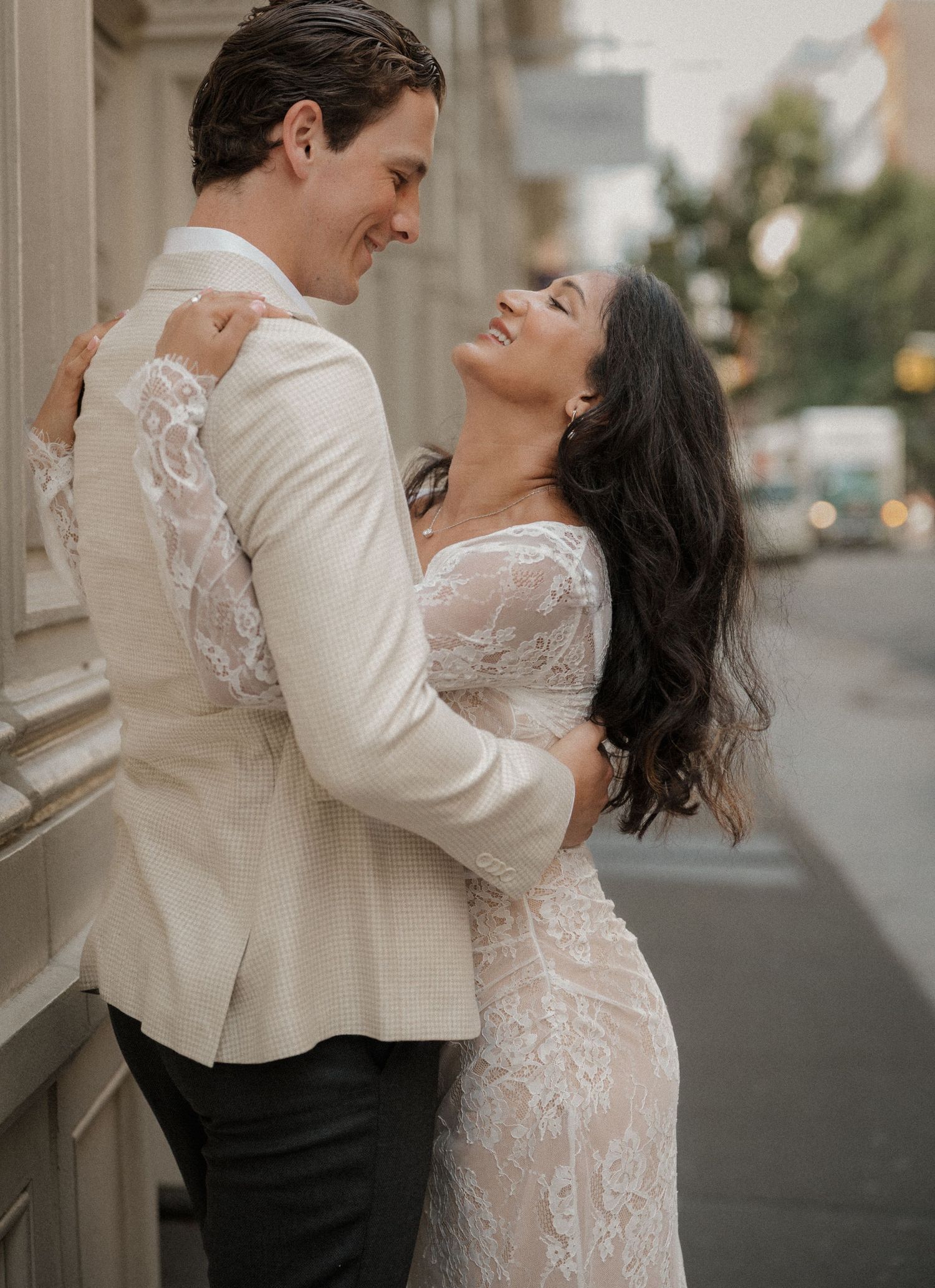 Engaged couple embrace in Soho, NYC
