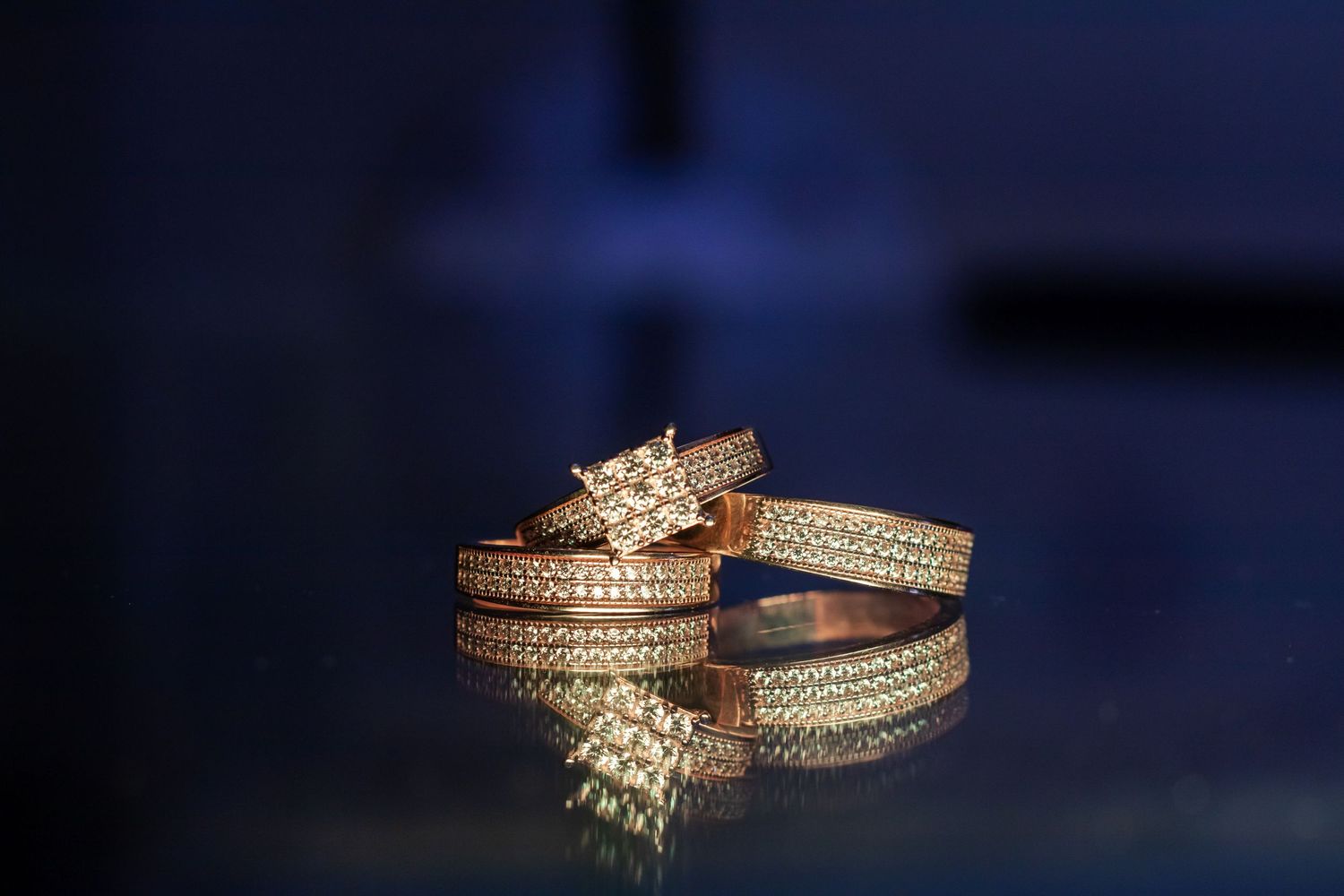 wedding rings on class table while Jamaican wedding photographer take amazing photograph in kingston jamaica.
