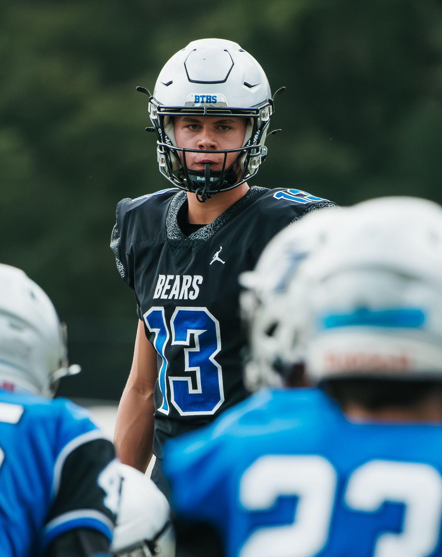 Football player wearing Bears jersey number 13 and white helmet stands focused during a game.