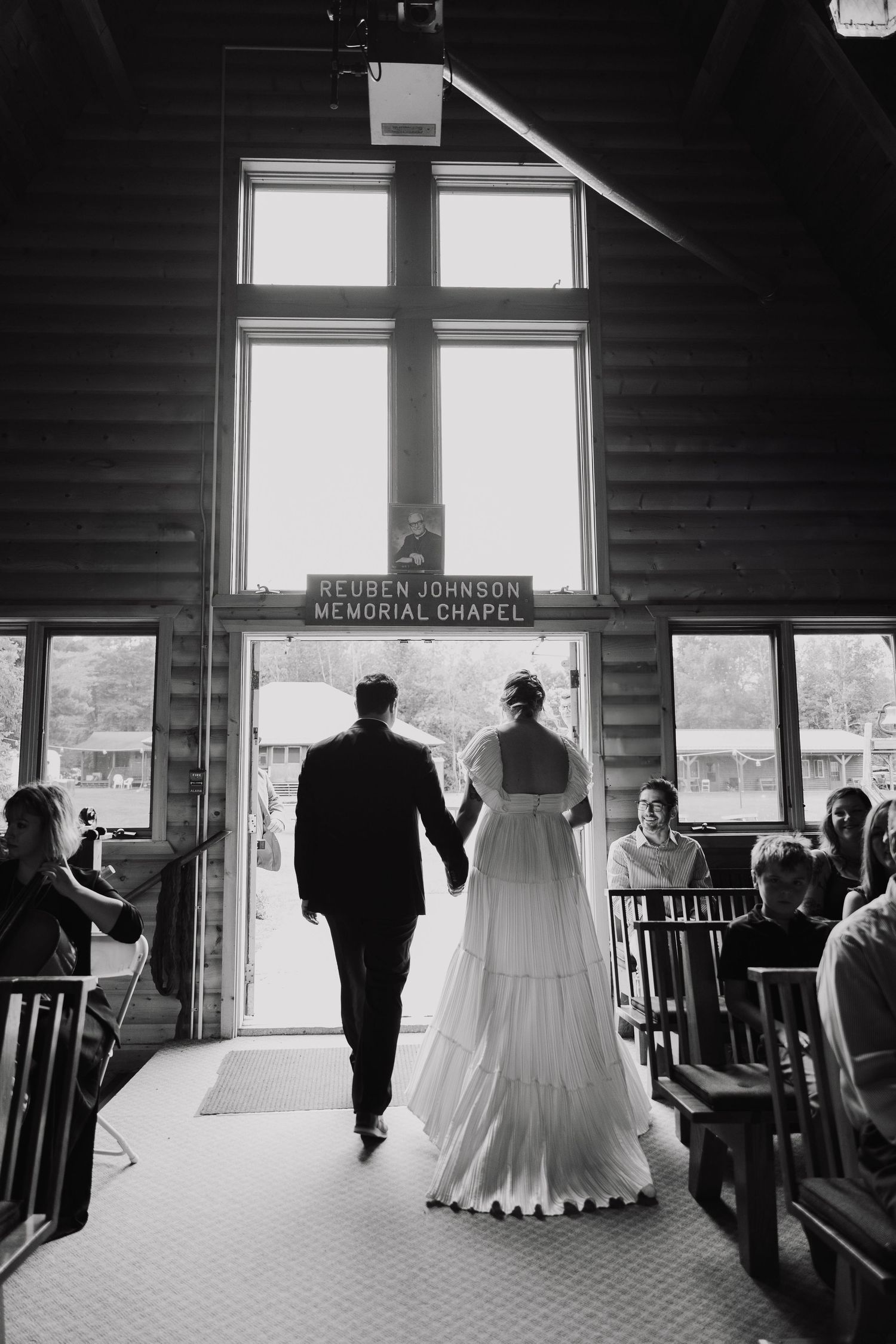 A series of black and white photos showing a couple walking through a chapel interior from different angles.