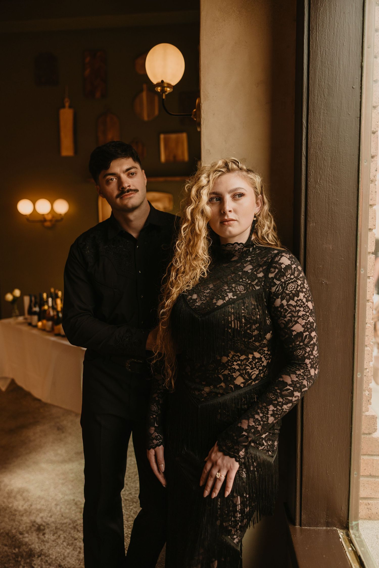 Couple poses for their welcome party at 2nd Street Bistro in Livingston, Montana captured by local Livingston Photographer the night before
