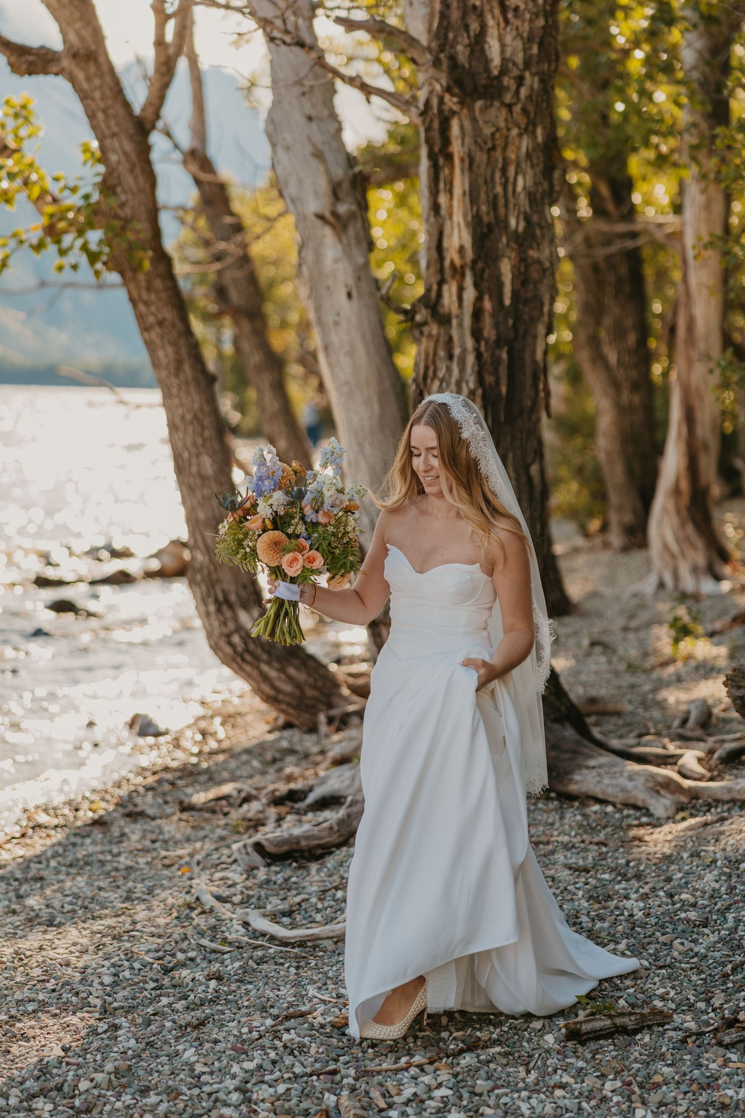 Bride walks over for her elopement ceremony in Glacier National Park captured by local Glacier Elopement Photographer based in Montana