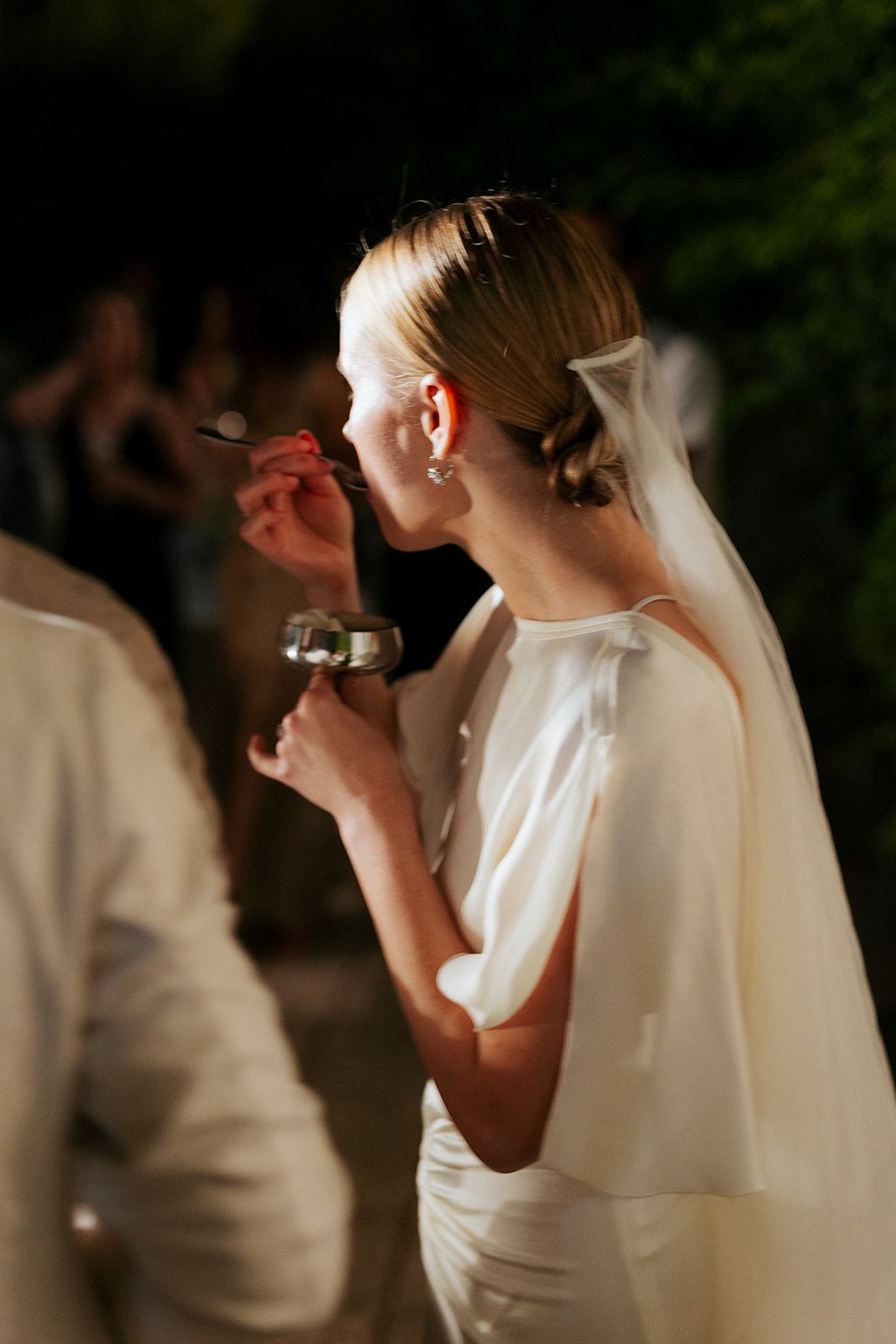 A sequence of cropped wedding photos showing a bride in white gown and veil lost in emotional moments.