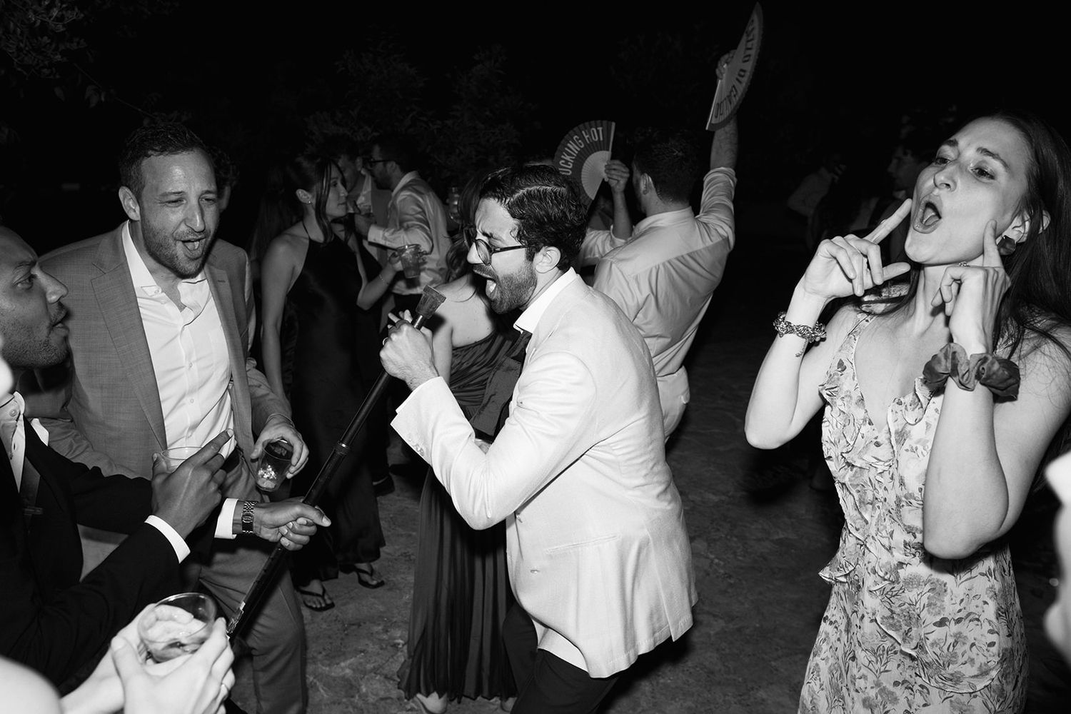 Black and white photo montage of people dancing at a celebration party event.