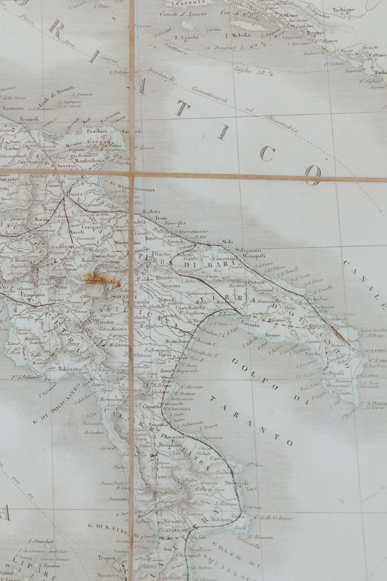 Vintage sepia-toned map showing geographical details with handwritten notations and grid lines.
