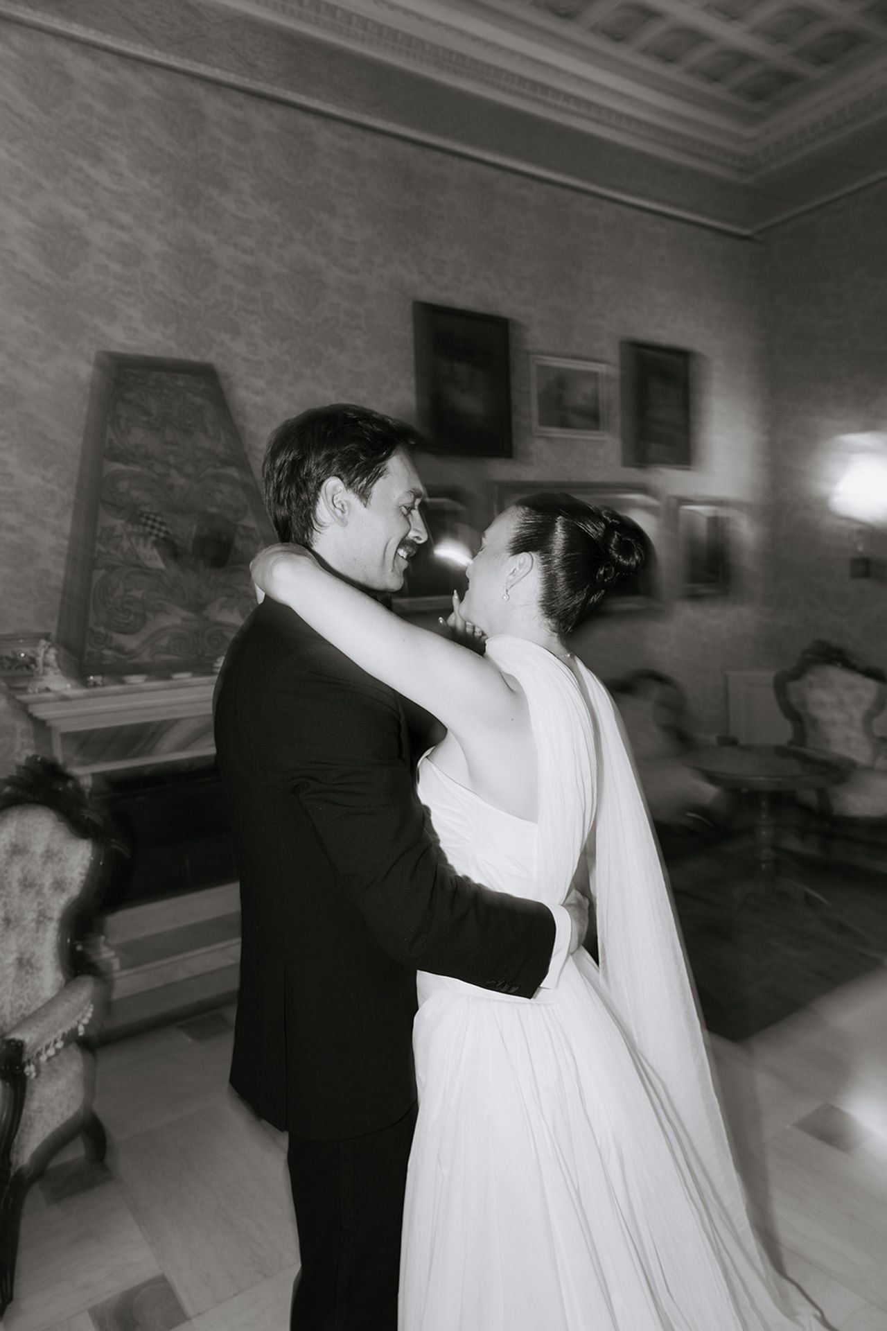A black and white photo sequence showing a couple's first dance at their wedding reception.