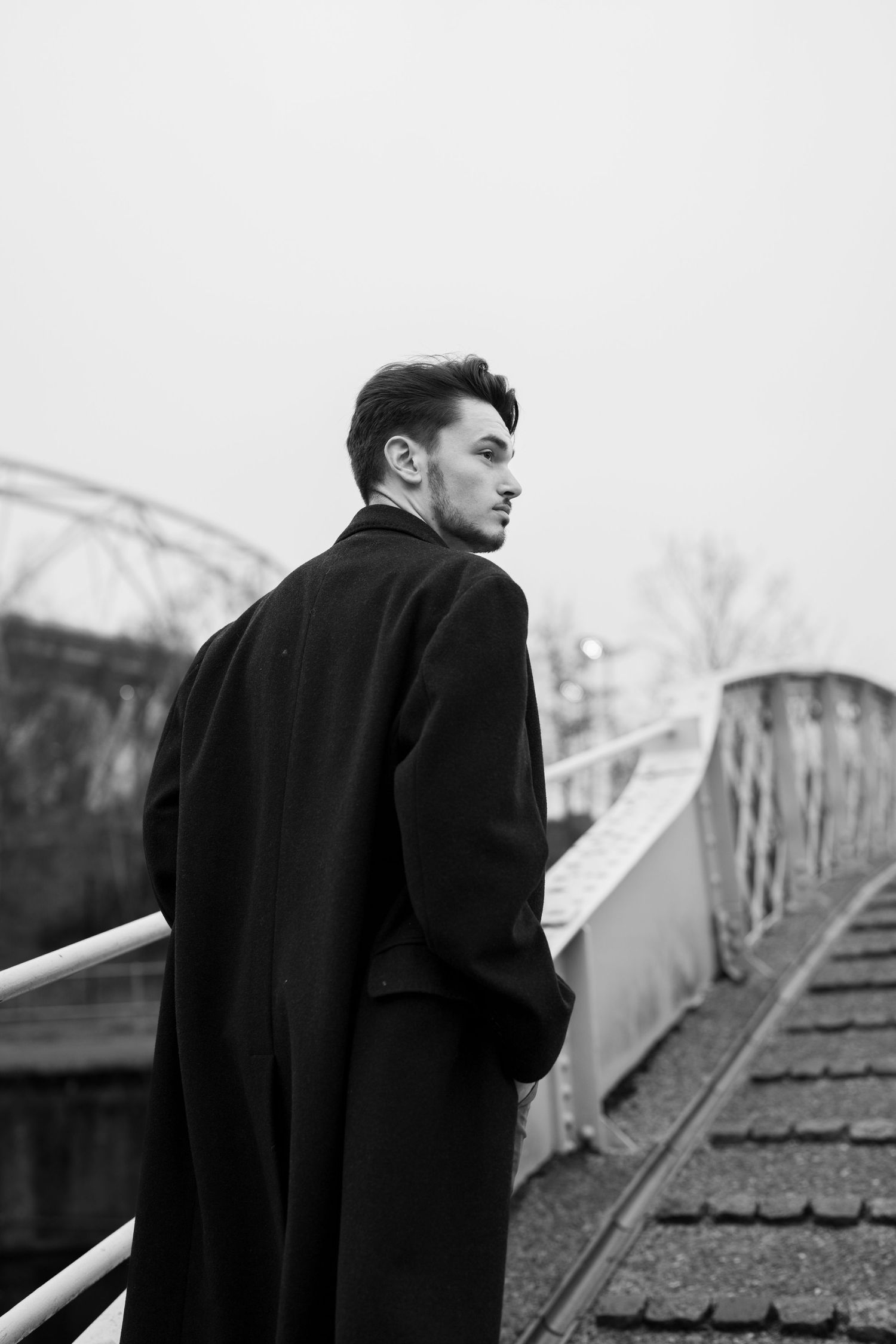 Moody black and white photo on metal stairs showing dramatic angles. London, UK.
