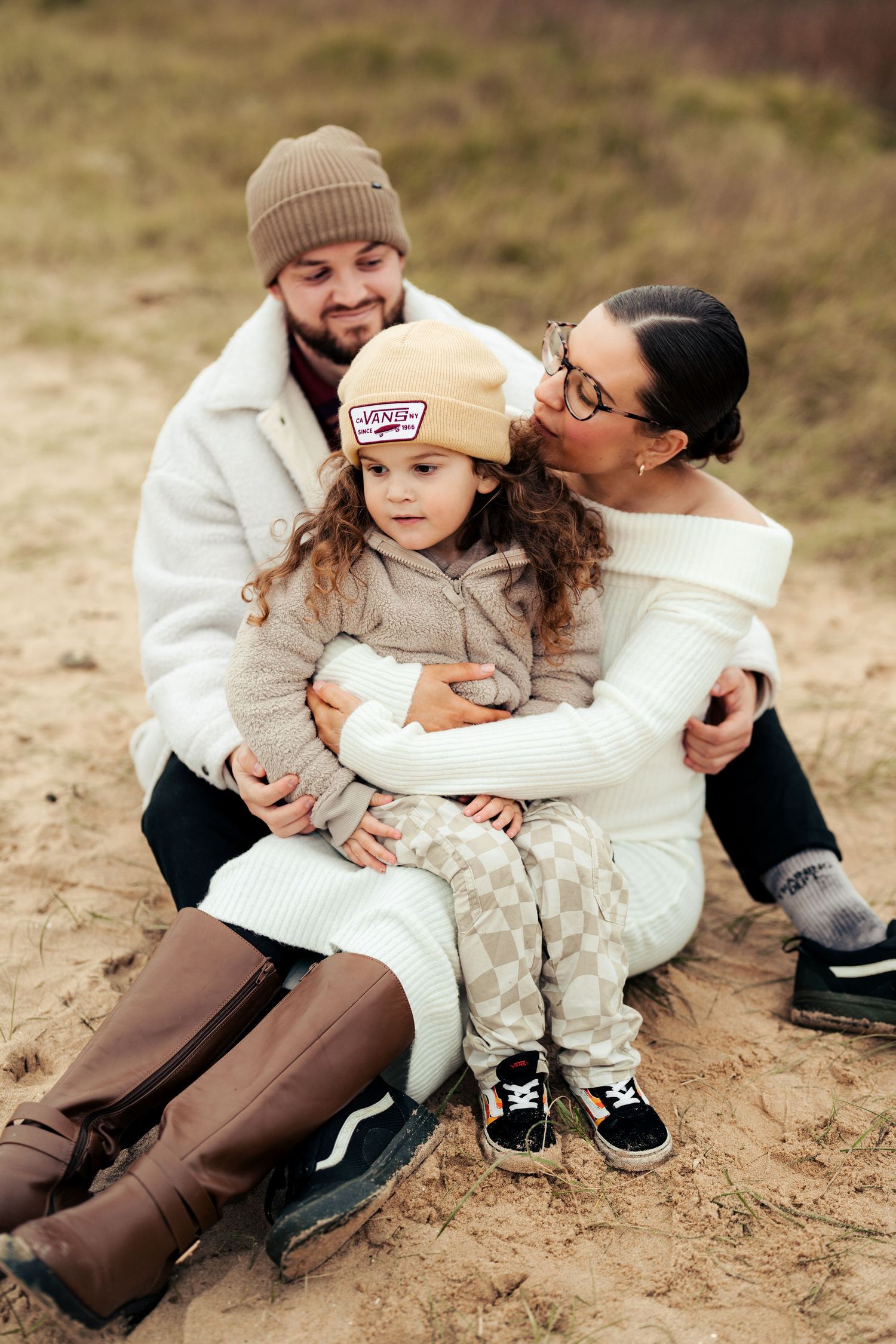 Intimate family moments captured in a series of casual outdoor portraits. Earlhams Beach, Harwich.