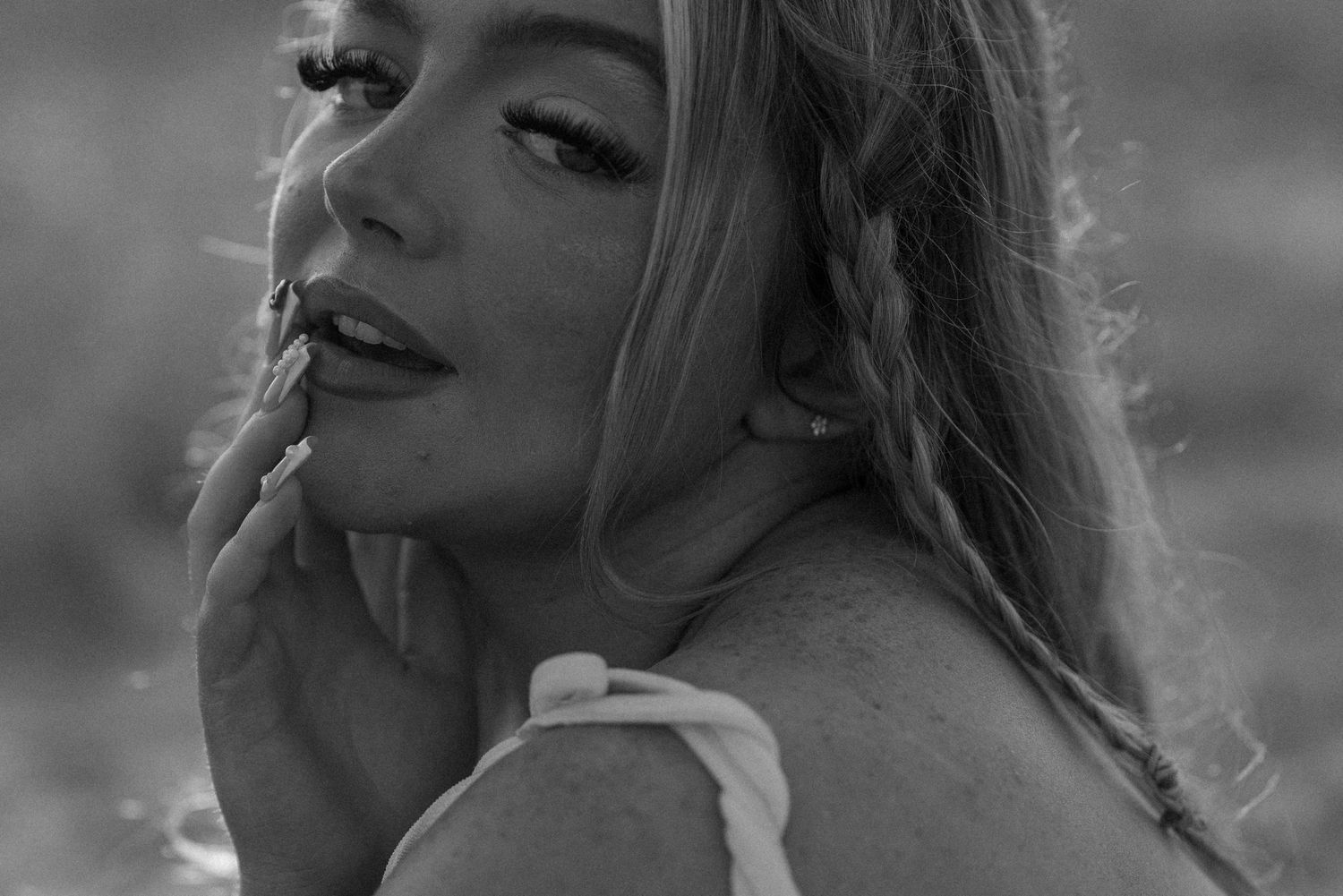 Artistic black and white close-up portraits showing expressive emotions and dramatic lighting. Earlhams Beach, Harwich, Essex.