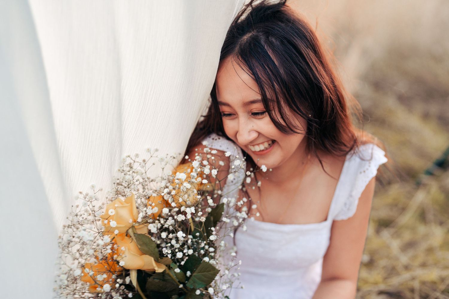 Delicate portrait series with white flowers and soft natural lighting. Wrabness, Essex.