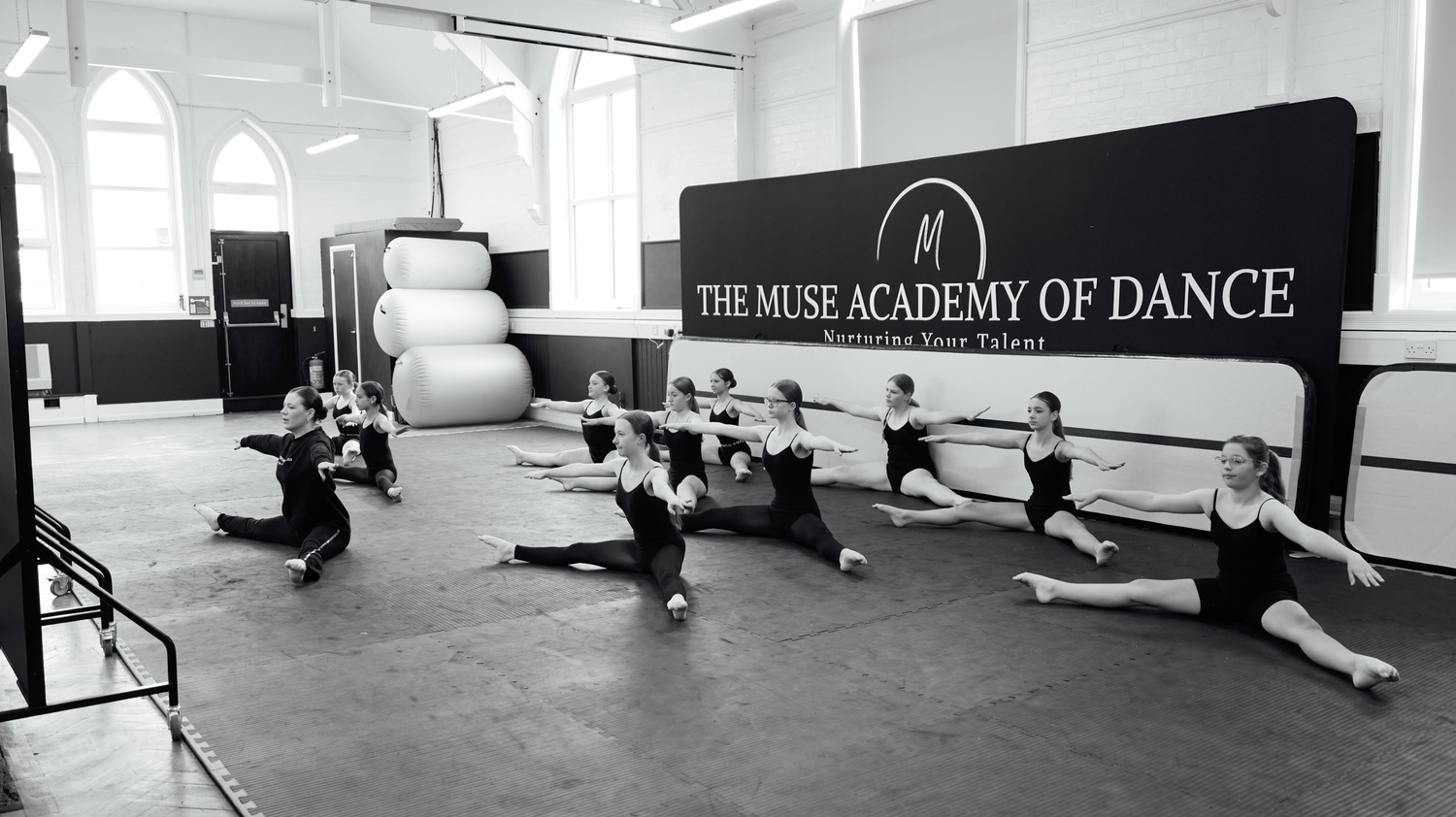 Modern white dance studio interior with mirrors and ballet barres. Harwich, Essex.
