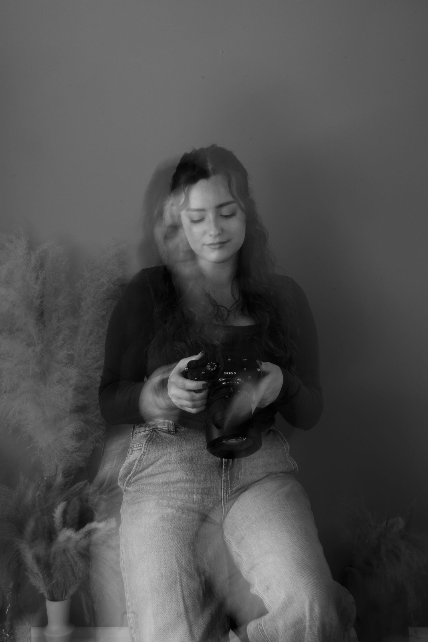 Artistic black and white portrait with smoke effects creating a dreamy atmosphere.