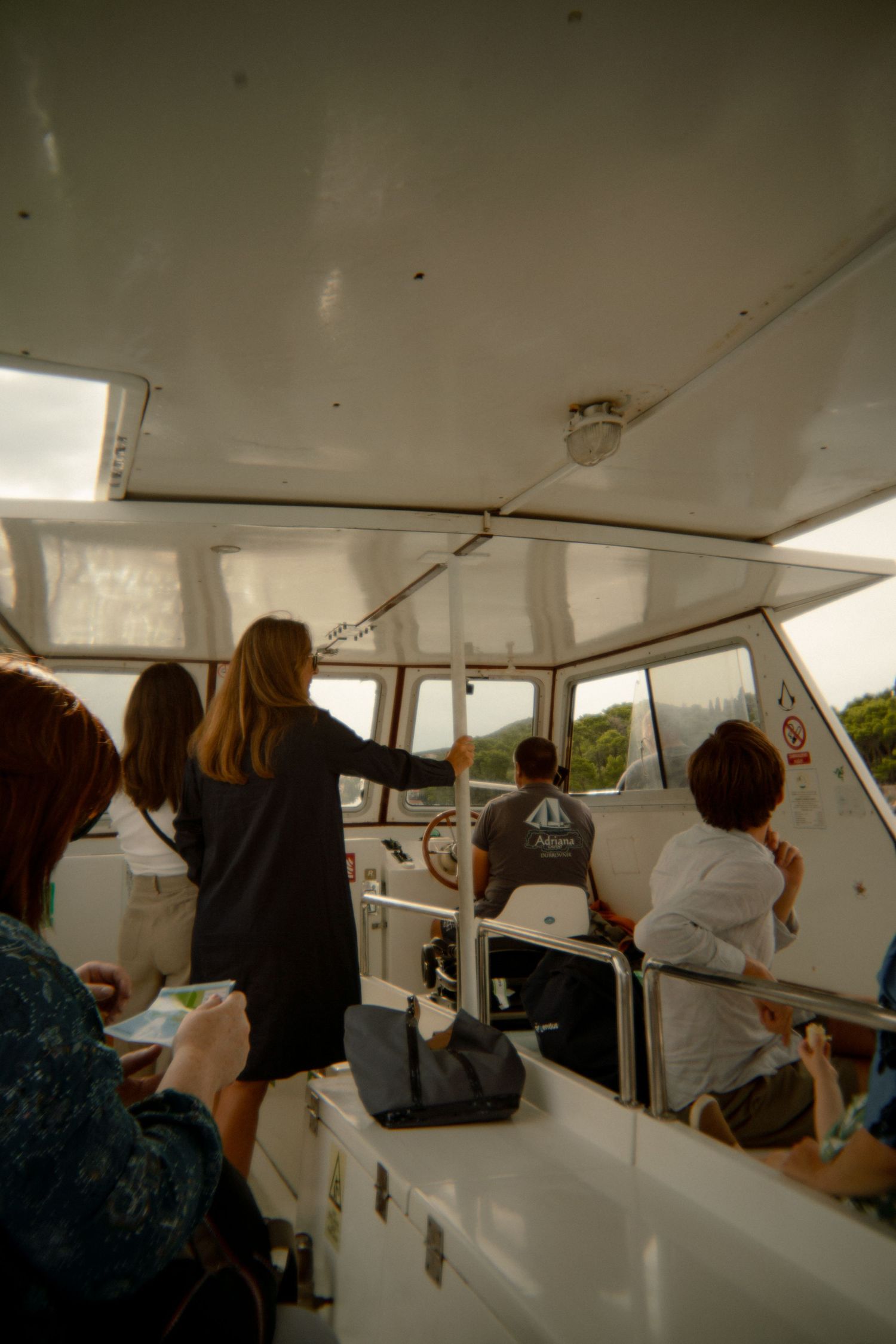 Interior view of passengers aboard a tour boat. Croatia.