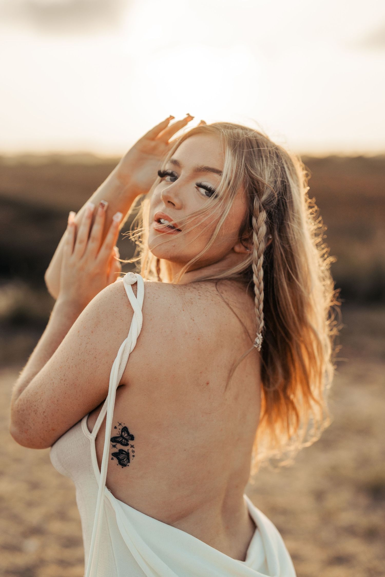 Golden hour portraits capturing joyful expressions and sunlit hair movement. Earlhams Beach, Harwich, Essex.