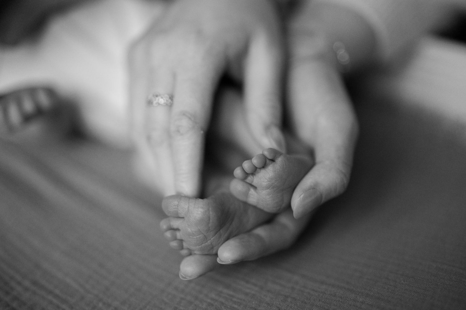 Close-up black and white detail shots of hands and fingers.