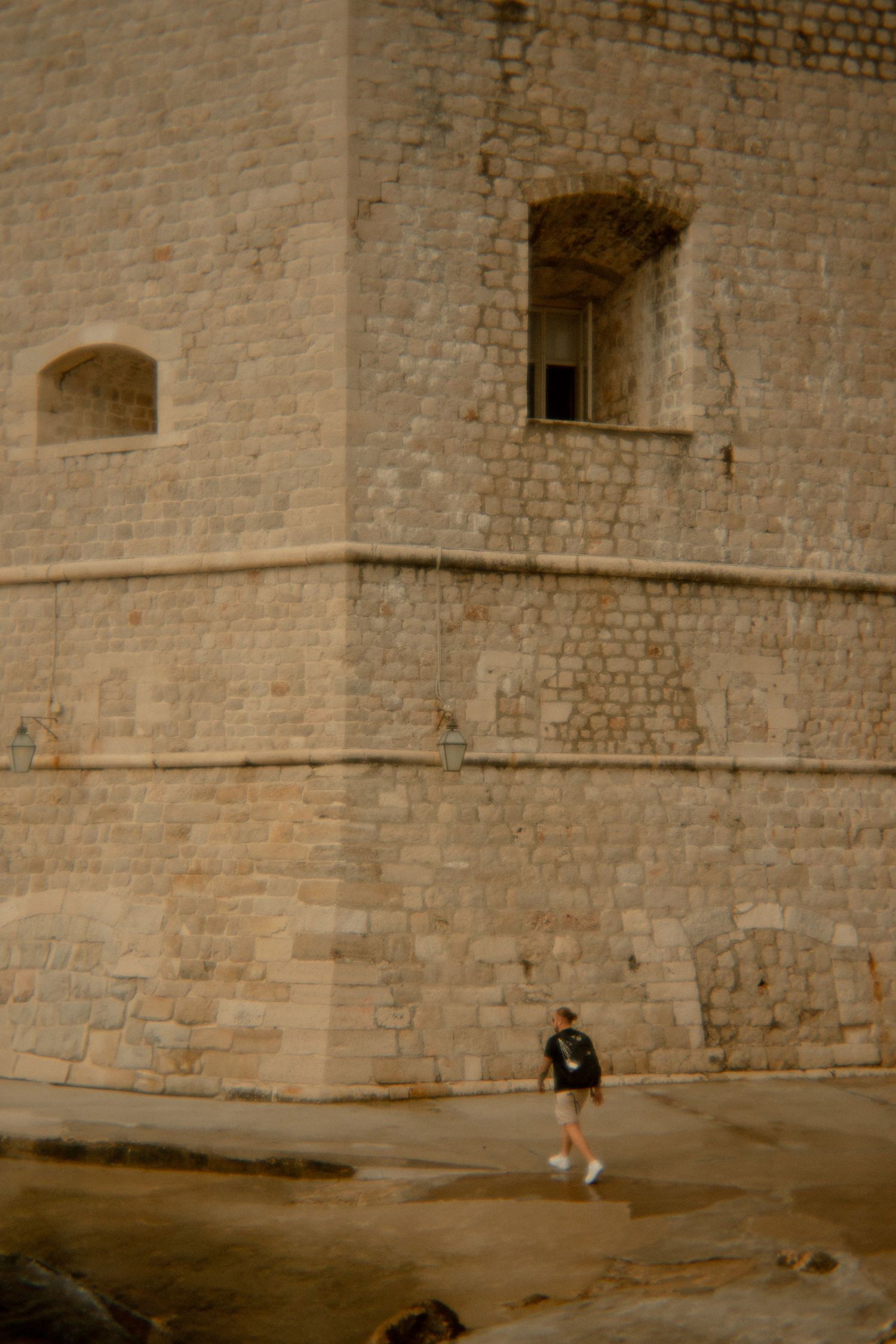 Ancient stone fortress walls with arched windows and doorways. Croatia.