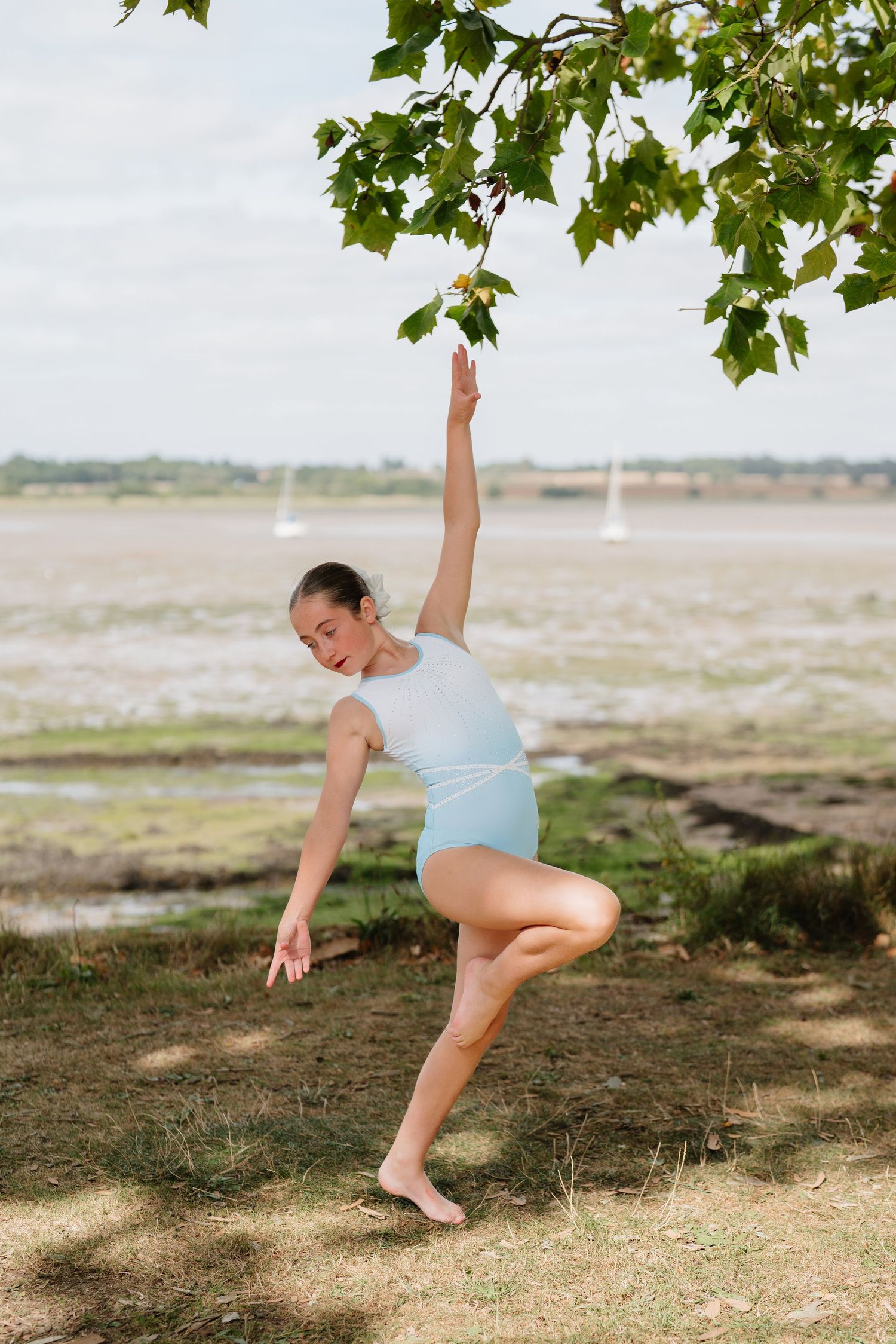 Athletic dance movements photographed outdoors against a natural coastal landscape. Manningtree, Essex.