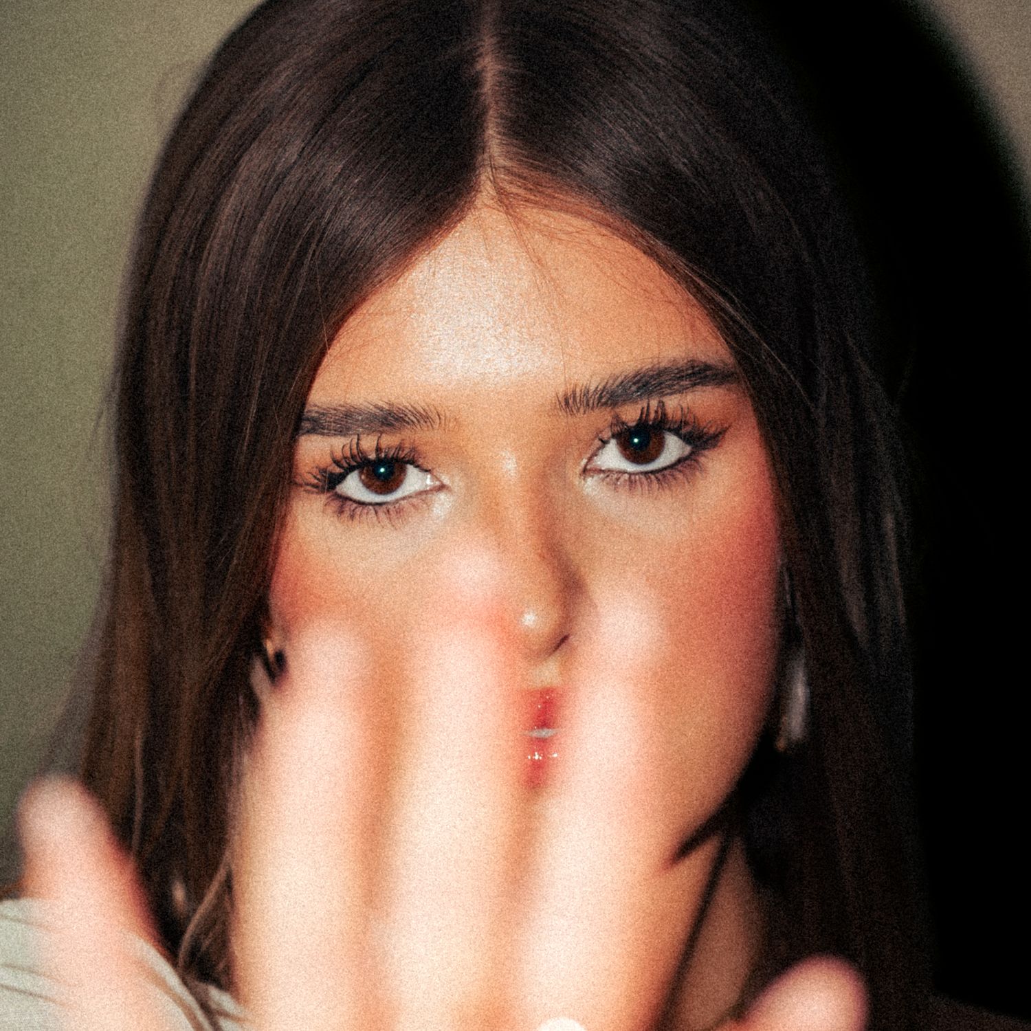 Close-up beauty shot with dramatic lighting highlighting eye makeup. Harwich, Essex.