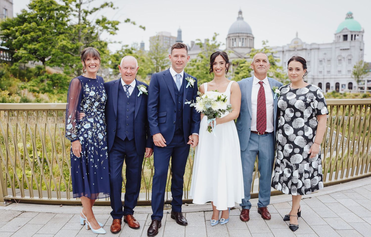 A panoramic sequence of wedding party members standing together on outdoor patios and gardens during a summer celebration.