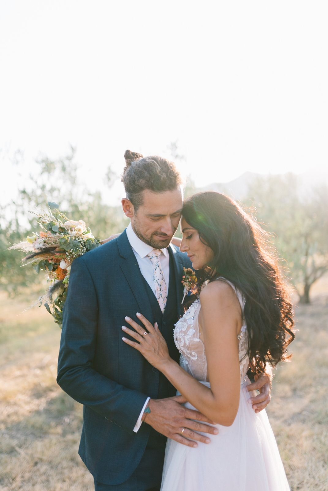 groom and bride portraits in an olive field at velventos kozani