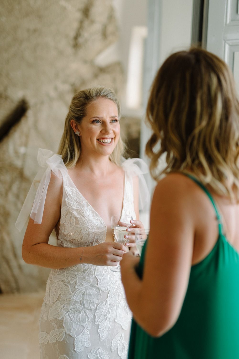 Wedding preparations in bright interior with lace dress details.