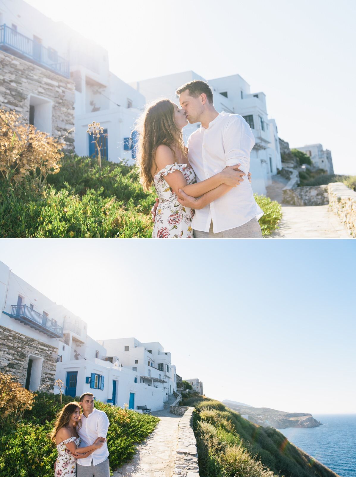 Couple embracing on scenic coastal path with traditional white Greek buildings in background.