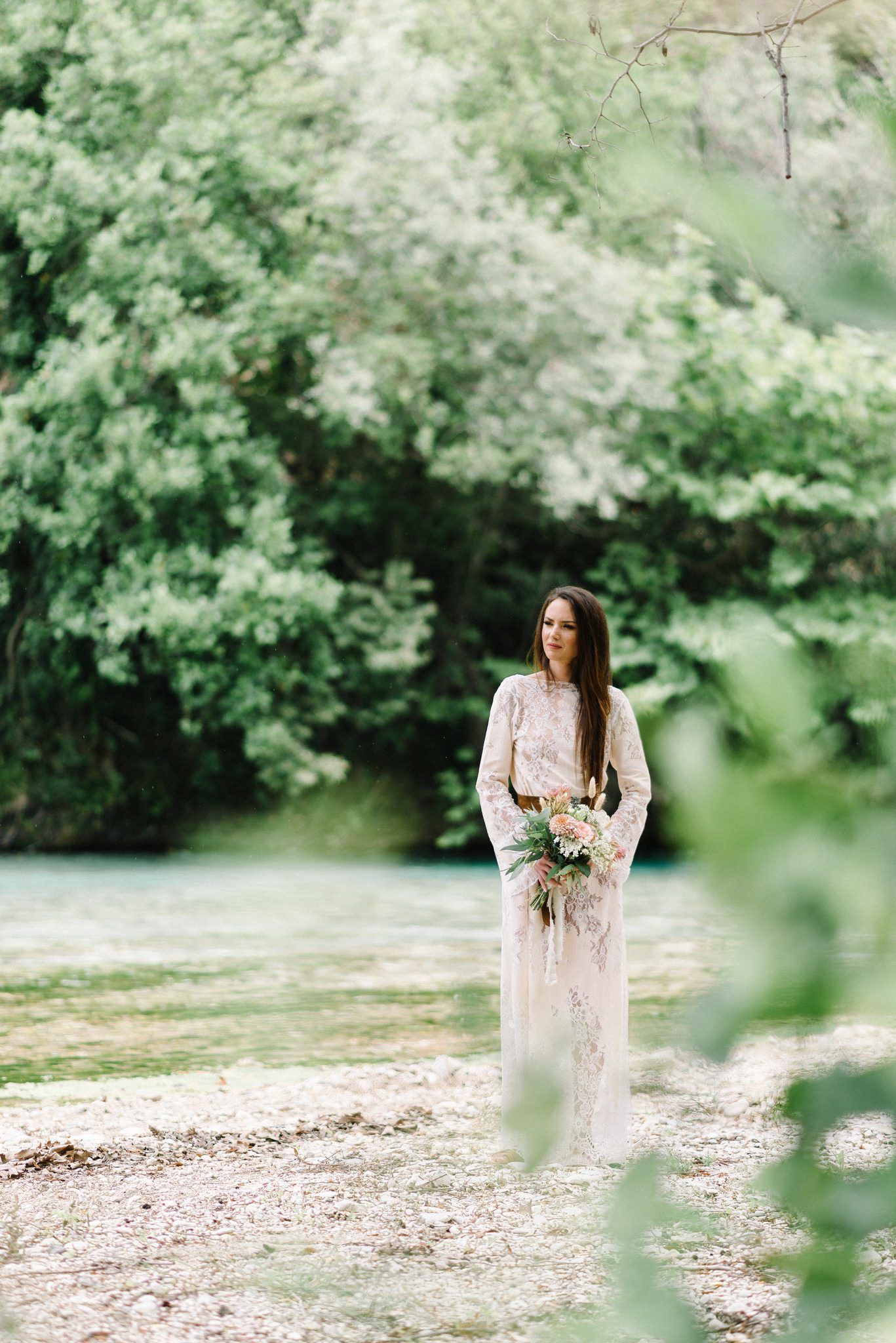 bride wearing nidodileda dress in acheron river
