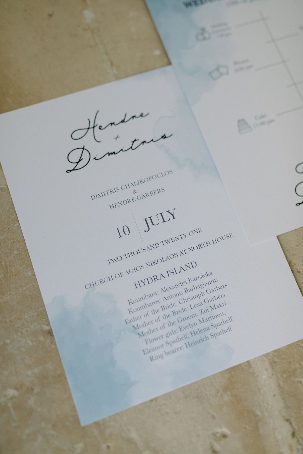 Wedding invitation with elegant calligraphy showing July date details.