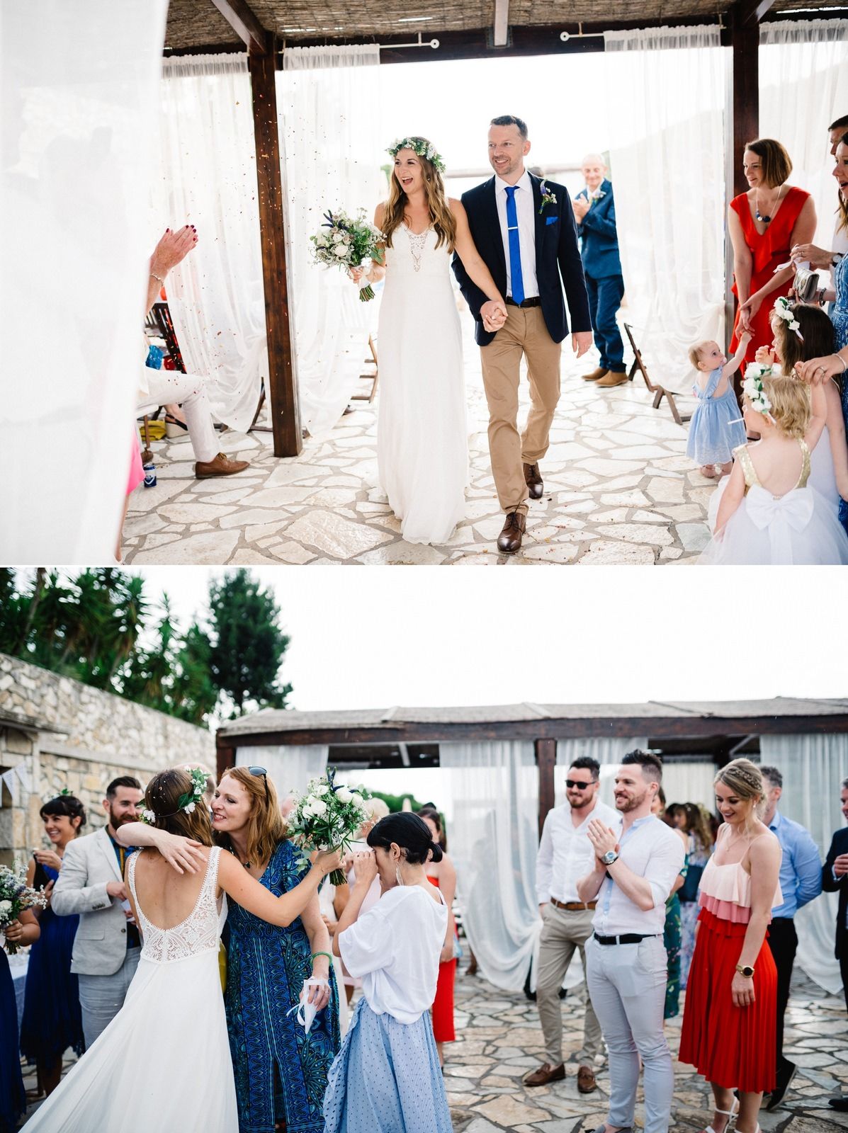 Joyful wedding celebration under a covered patio with stone flooring and white curtains.