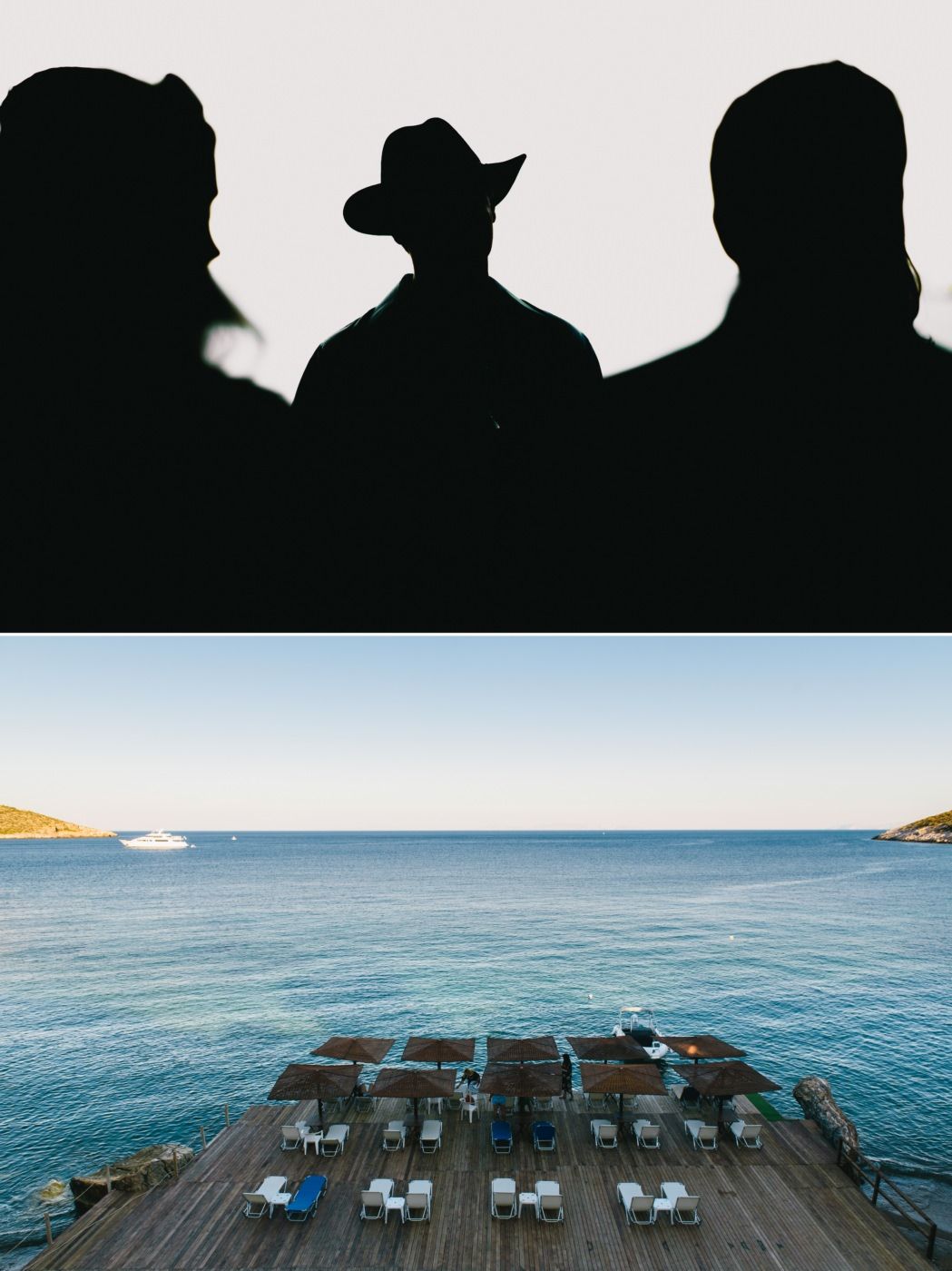 Waterfront deck with lounge chairs overlooking a calm blue ocean, with silhouettes in foreground.