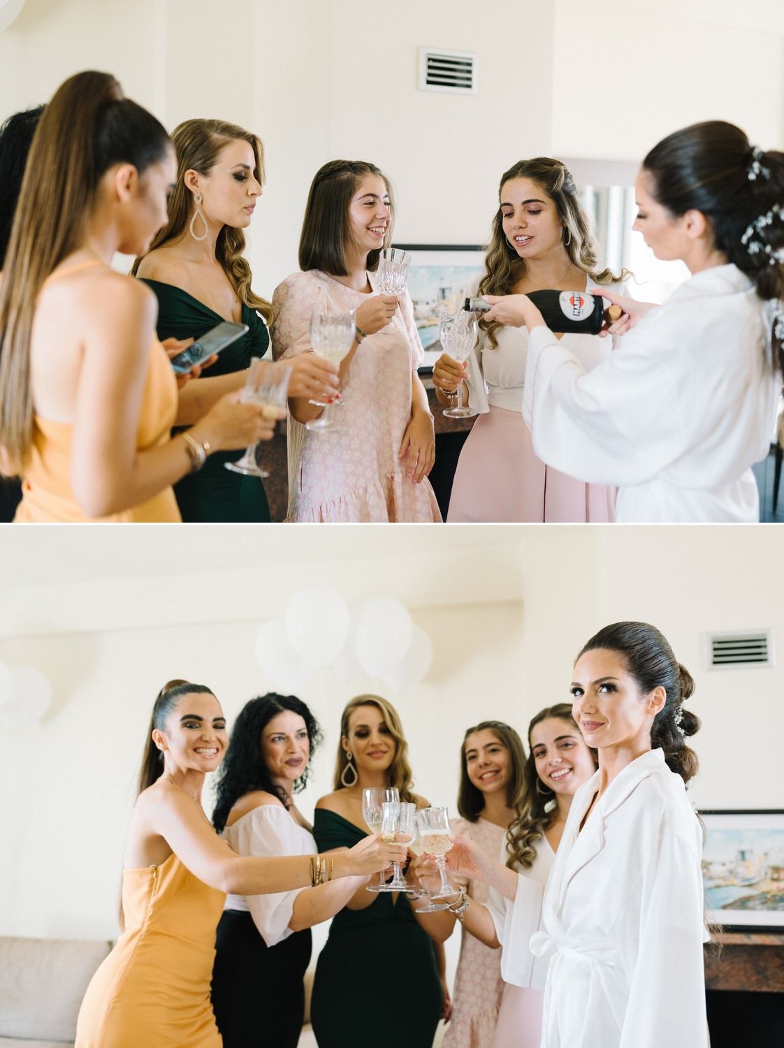 Bridal party in mix of formal dresses toasts with champagne glasses during wedding preparations.