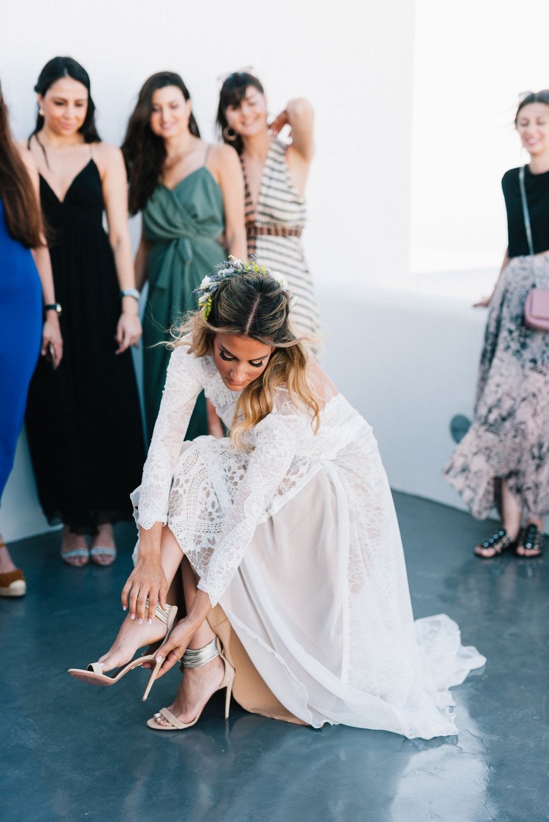 bride wearing her wedding shoes in folegandros