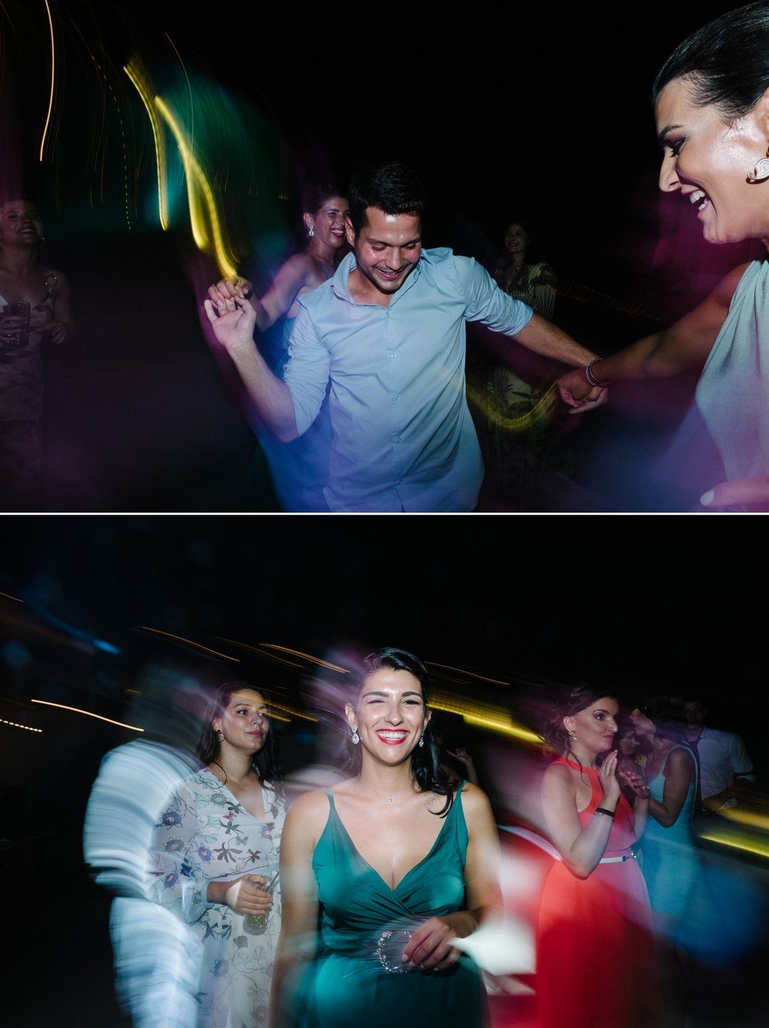 Wedding party dancing and celebrating under colorful lights at night reception.