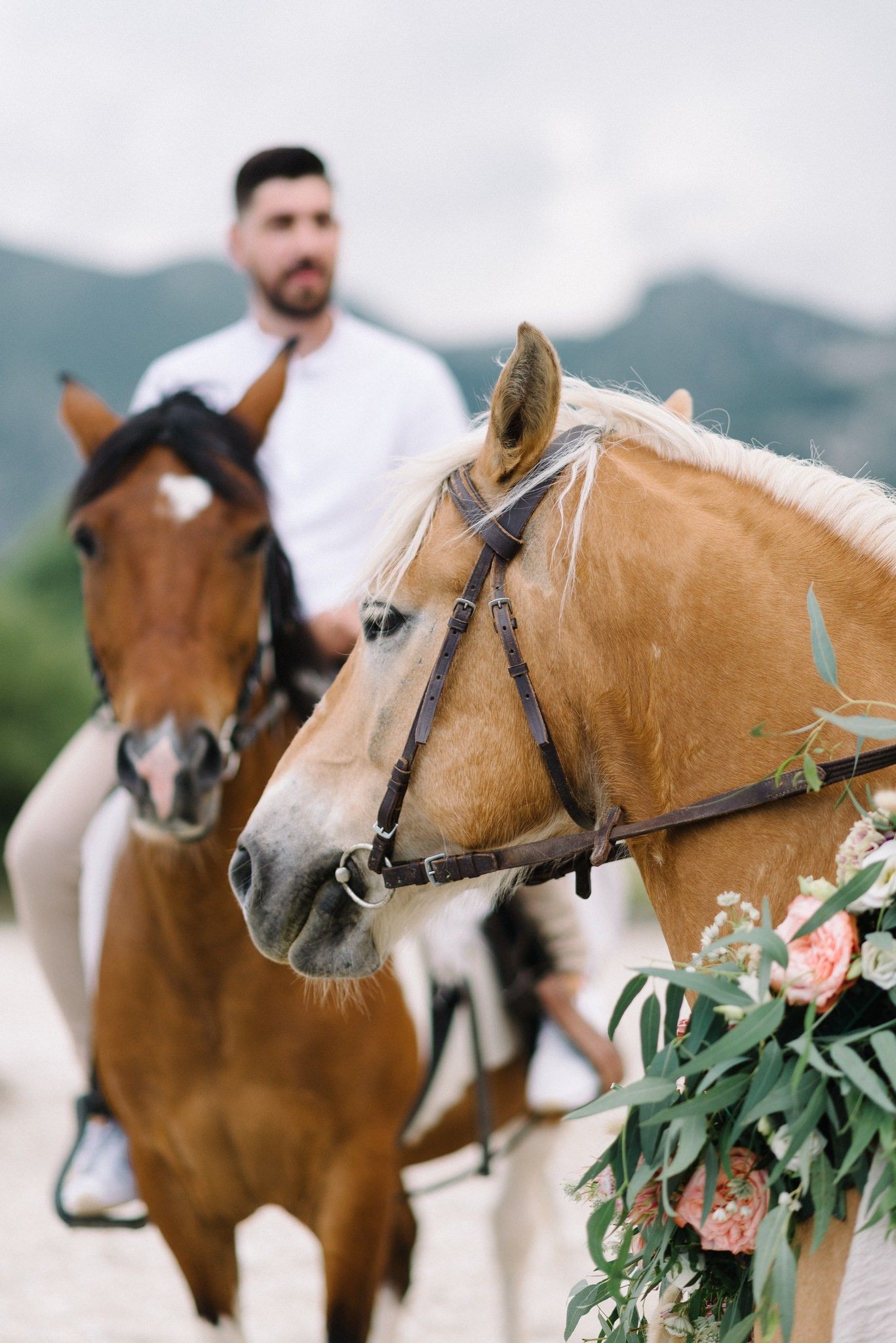portrait of groom riding a horse in acheron river in greece