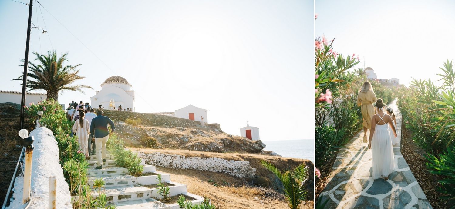 A seaside wedding ceremony setup with white buildings and stone pathways in Greece.