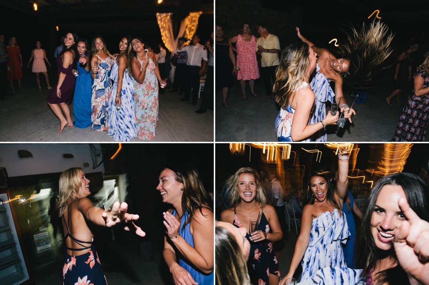 Energetic wedding guests dancing and celebrating at the reception in floral summer dresses.