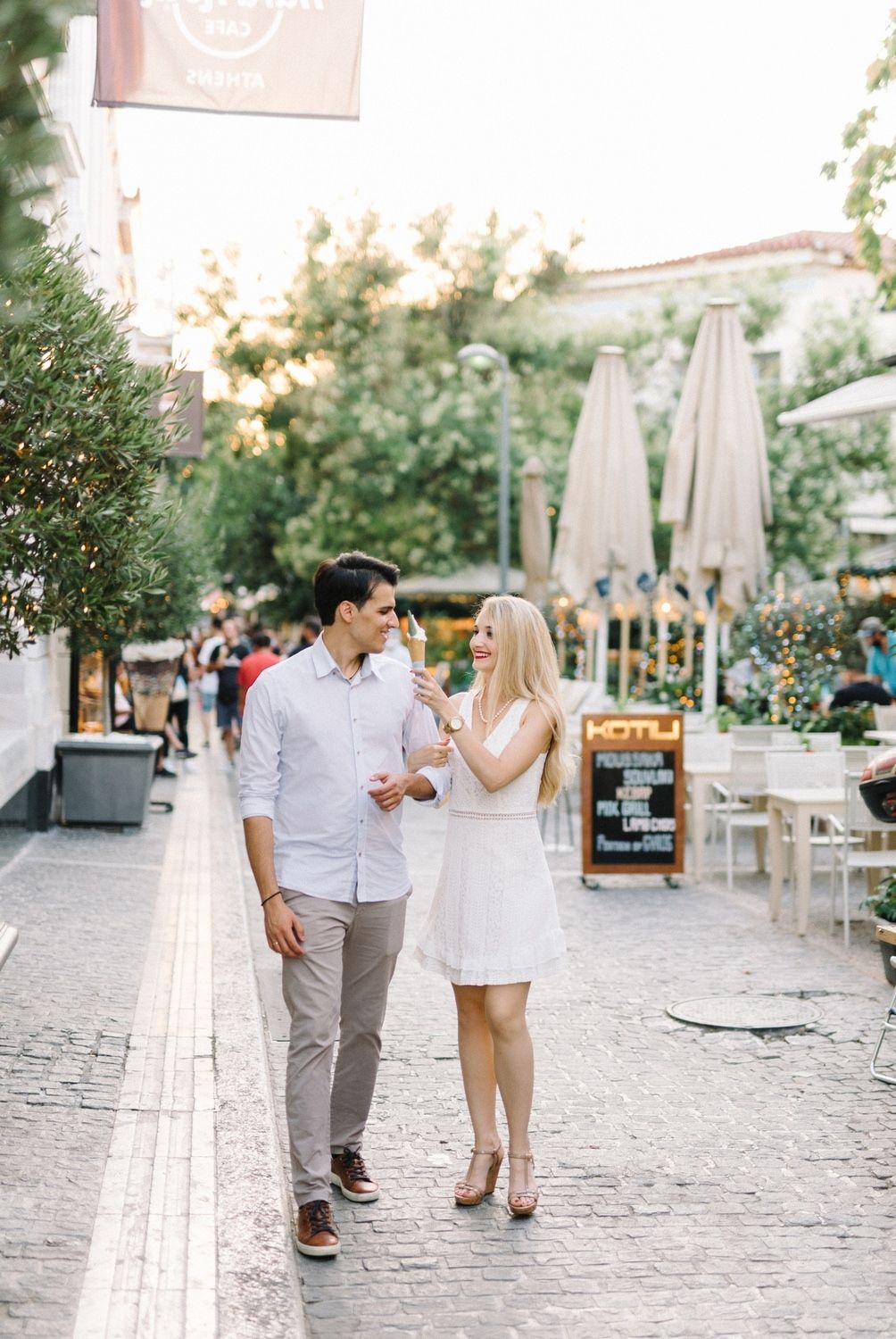 couple walking in monastiraki athens