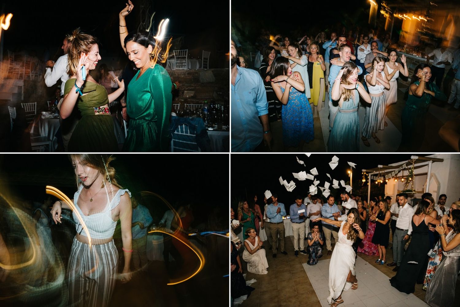 Wedding party dancing in a dimly lit venue with sparkler exit moment.